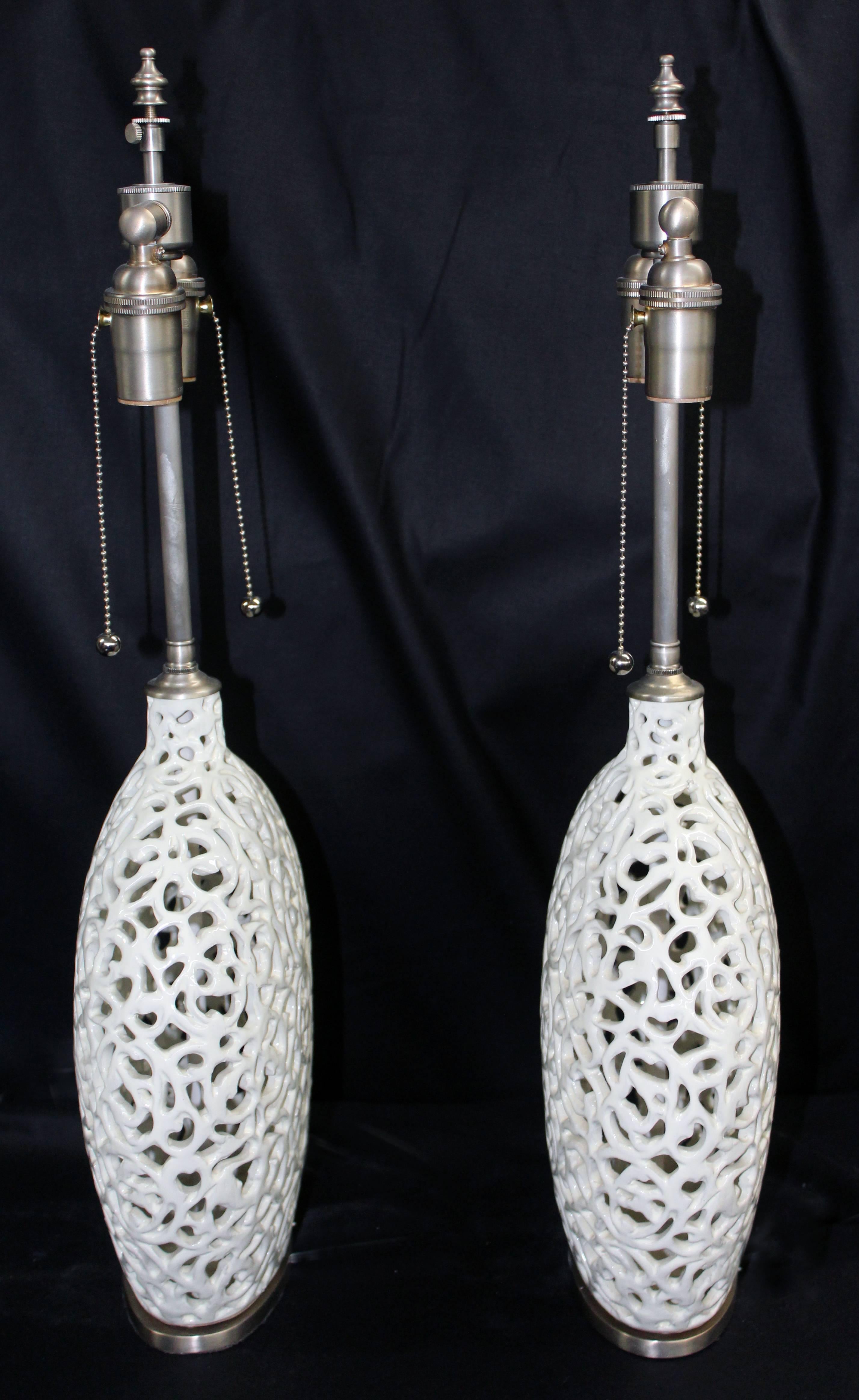 Spanish Unusual Pair of Cream Colored Ceramic Filigree Vessels with Lamp Application For Sale