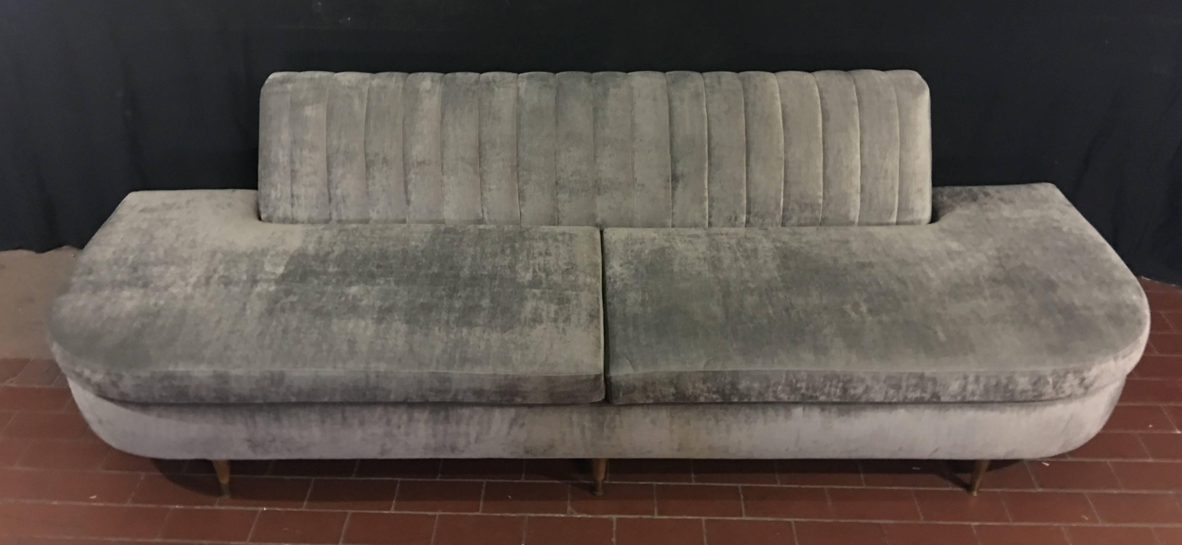 Newly refurbished and reupholstered Vintage midcentury sofa. Covered in a soft pale green velvet this midcentury sofa is as stylish as it is comfortable. In keeping with the style of the period in which it was created, the seating composition is