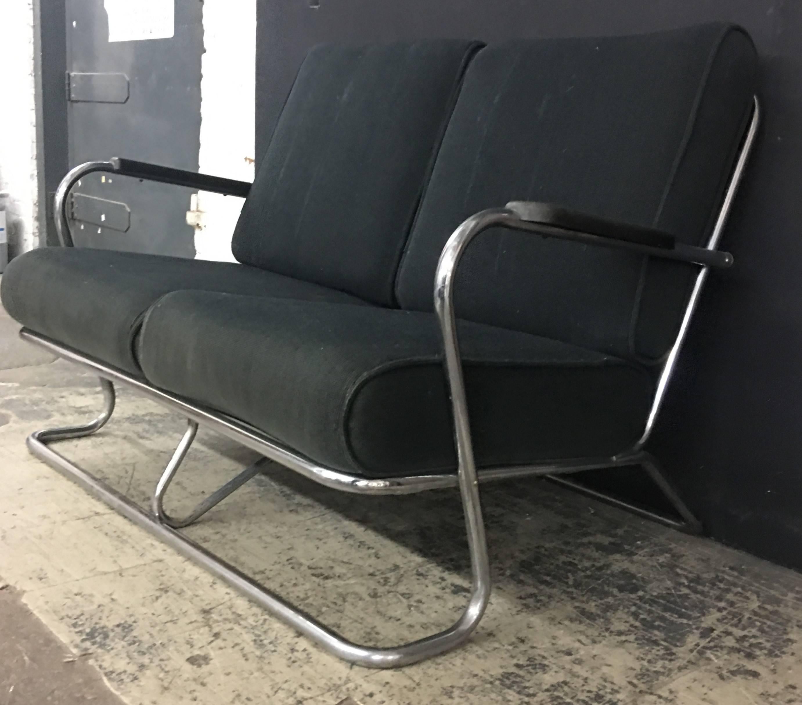 Kem Webber designed chrome tube sofa from Lloyd manufacturing. The sofa is in its original fabric. The arm height is 23