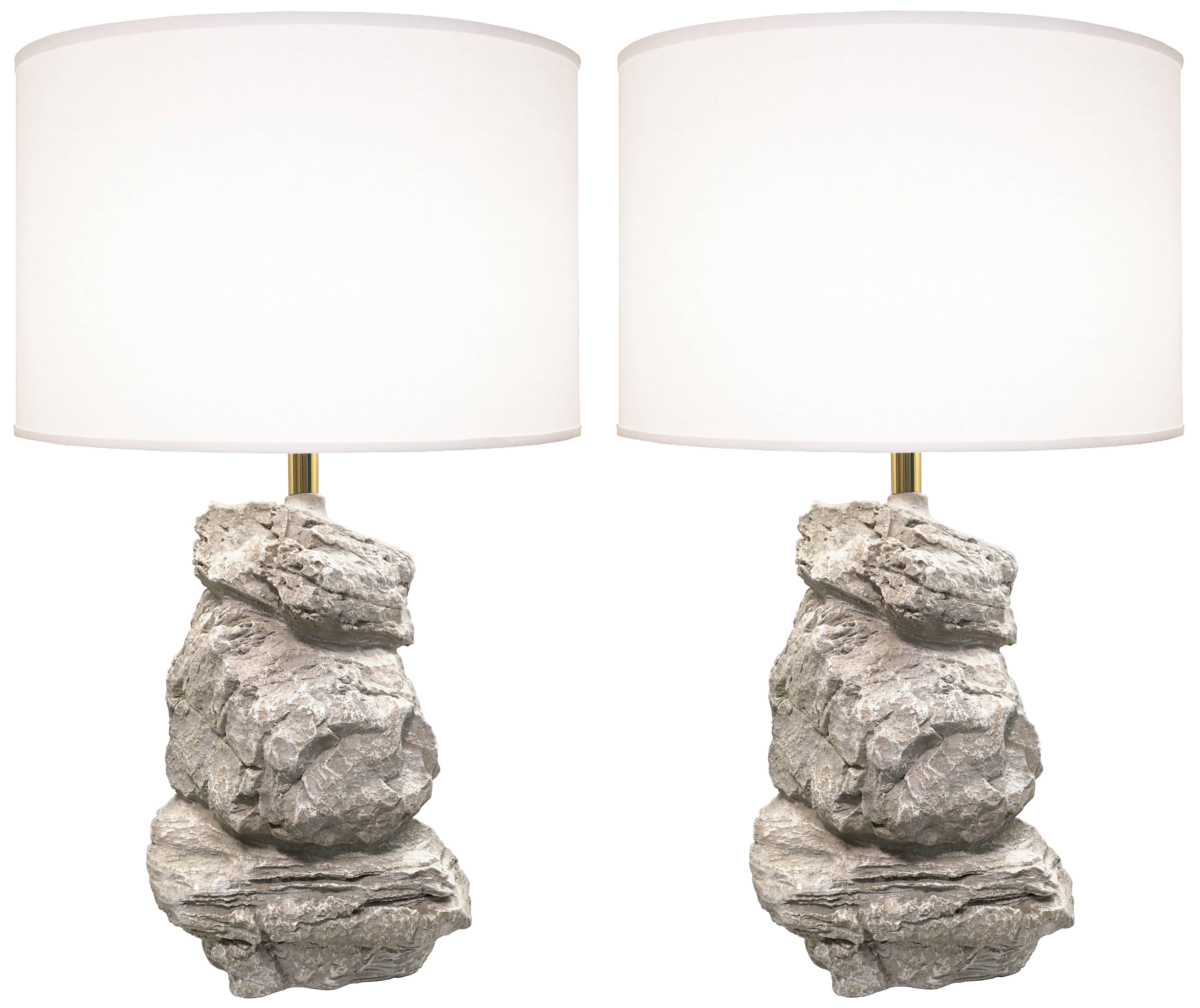 A pair of rock-form sculptural lamps with brass hardware.

American, 1980's

Measurements of body of lamps: 17