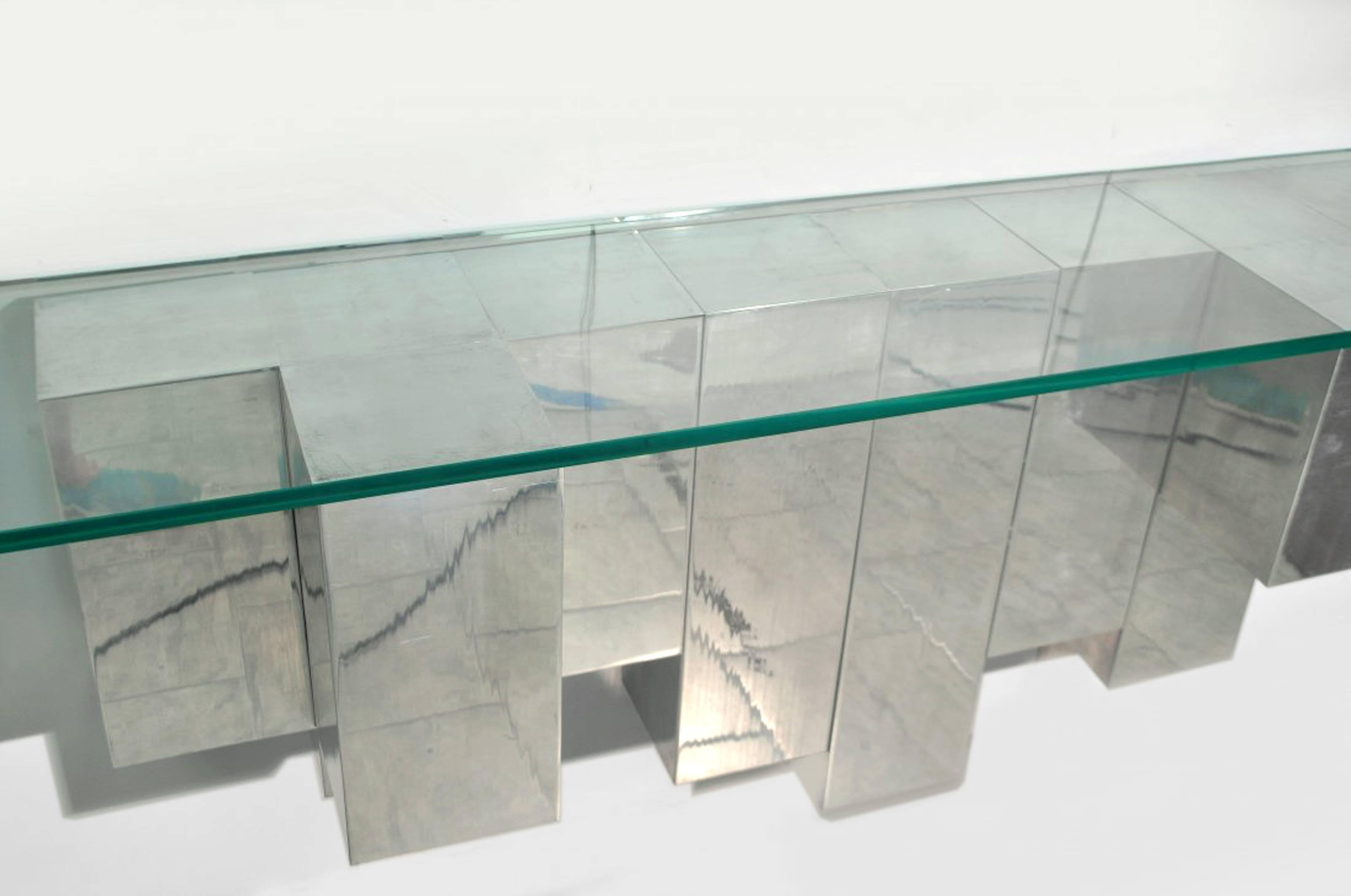 A sculptural polished aluminium console with glass top by Cy Mann.

American, Circa 1970's

Wall sculpture also available.

In Stock.
 