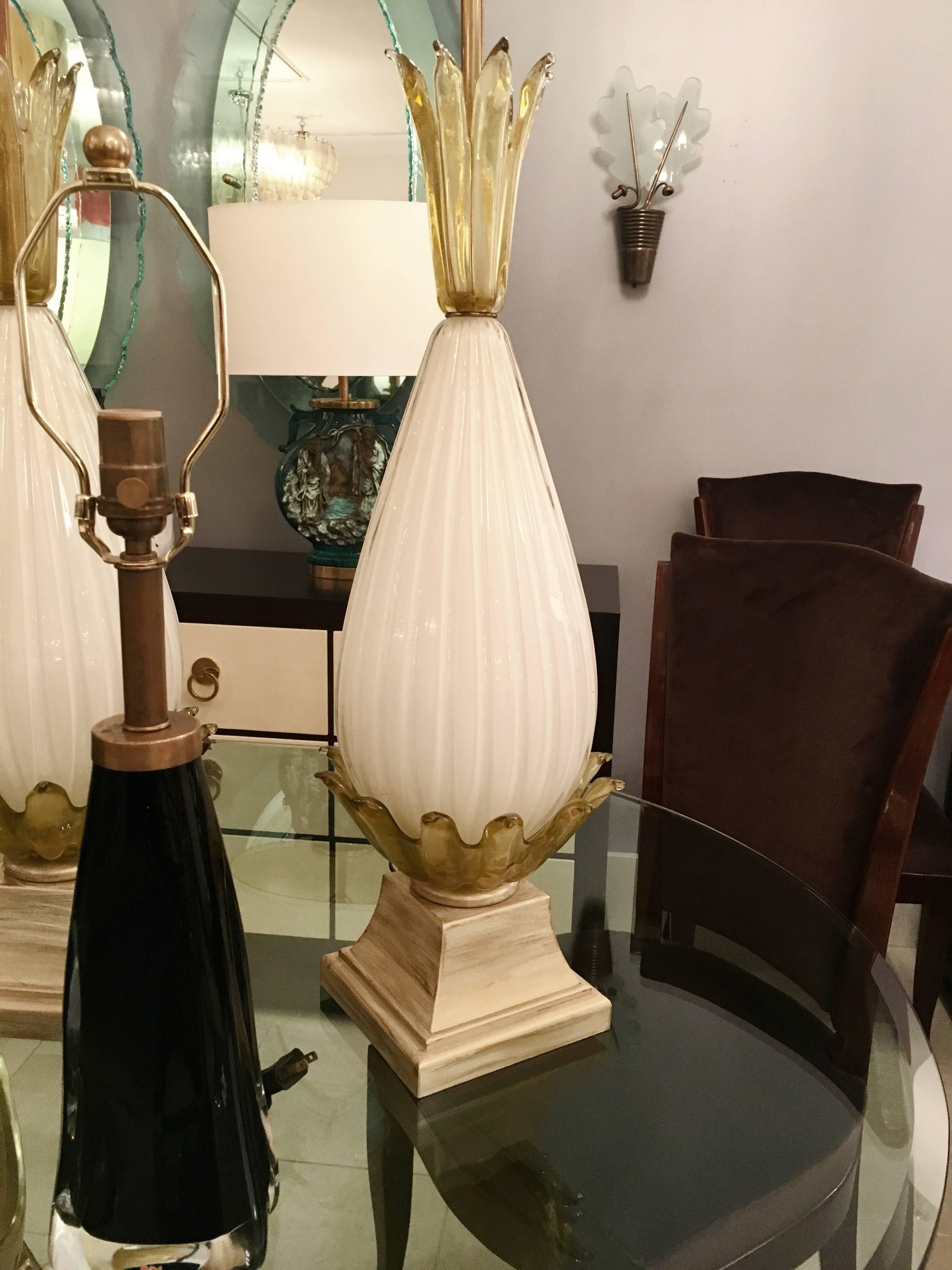 A pair of fluted glass lamps with botanical glass detail on wood bases with cerused painted finish. 

Italian, Circa 1940's

Lamp Shades Are Not Included.

If you are interested in Lamp Shades, please email The Craig Van Den Brulle Design Team Via