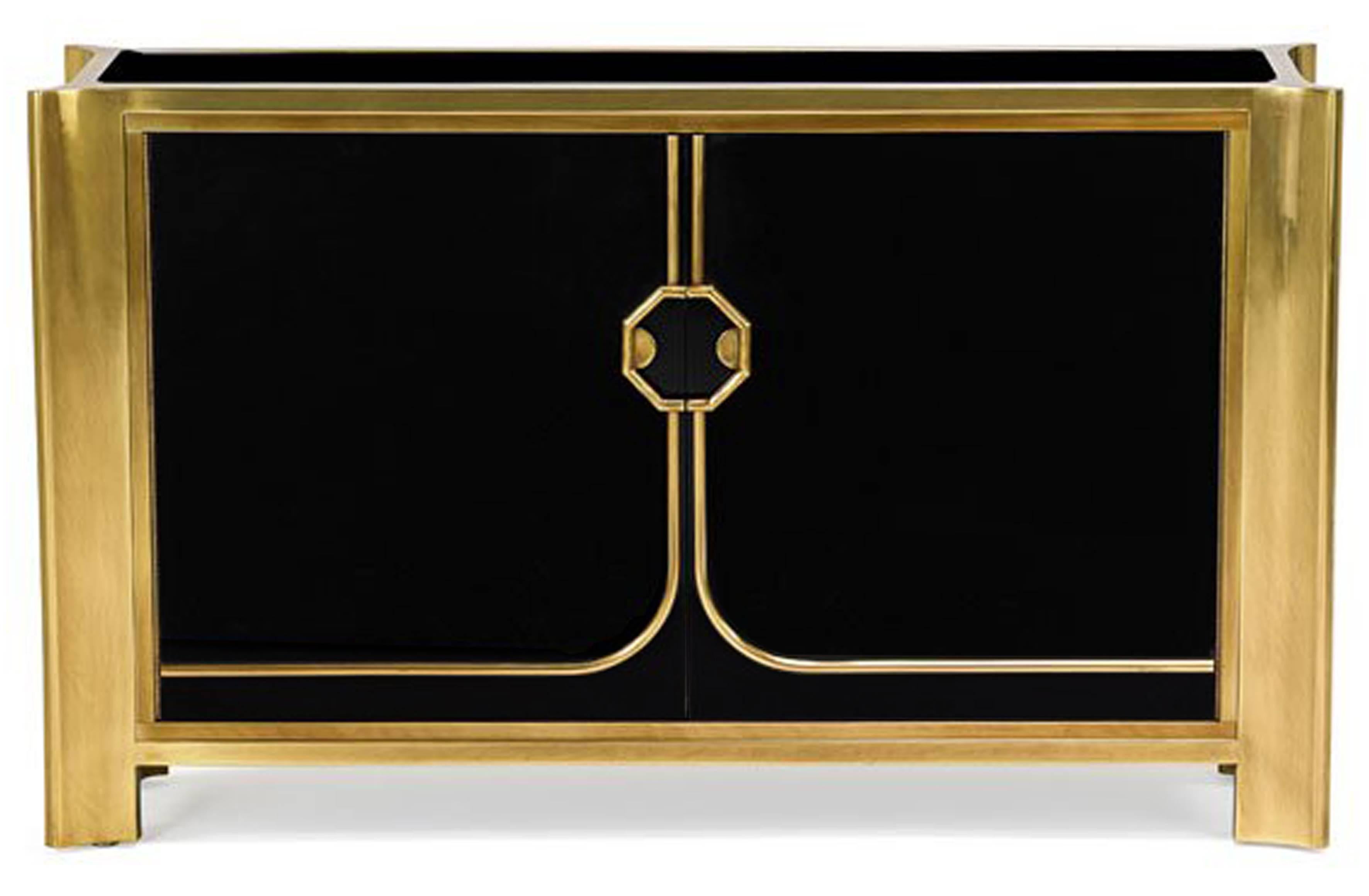 A black lacquered two door cabinet with patinated bronze frame and hardware with one adjustable shelf by Mastercraft, American, 1970s.