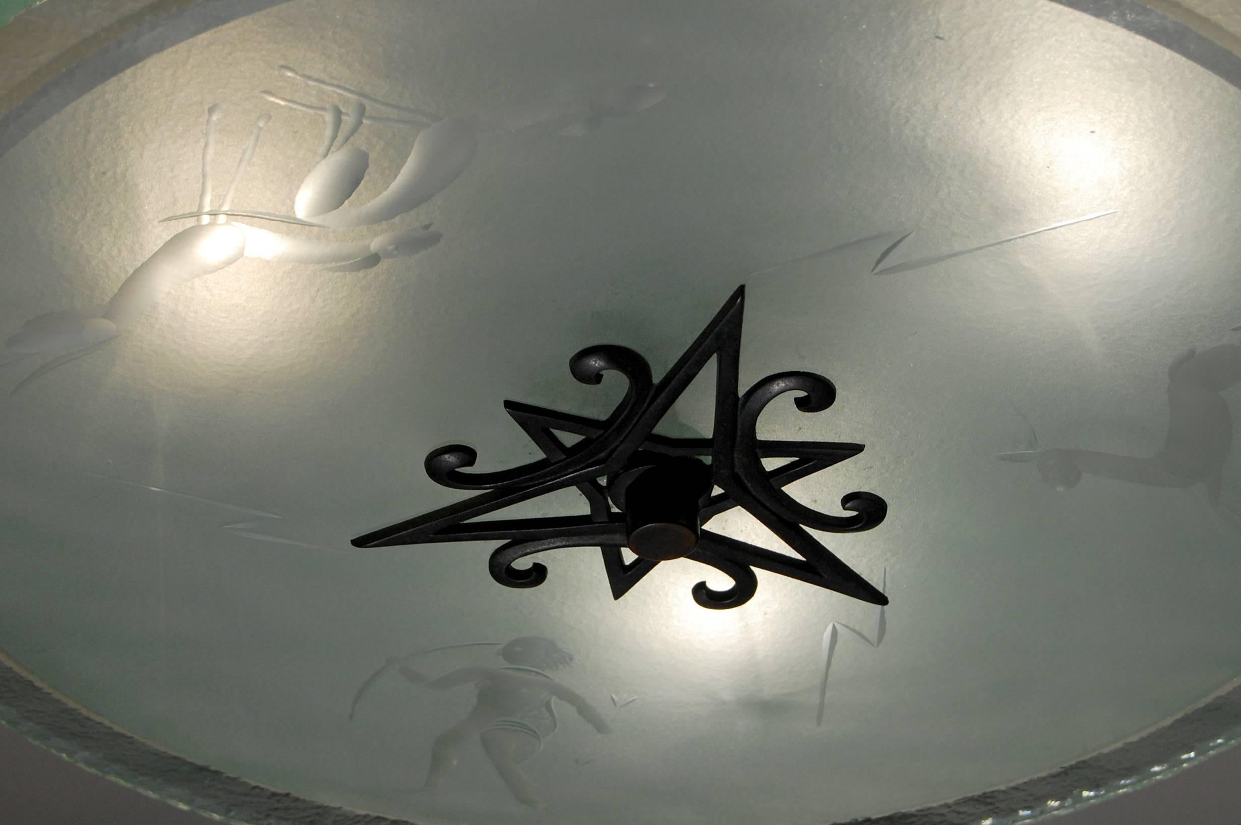 An etched glass fixture with blackened hardware and canopy.

Italian, Circa 1940's

In stock.