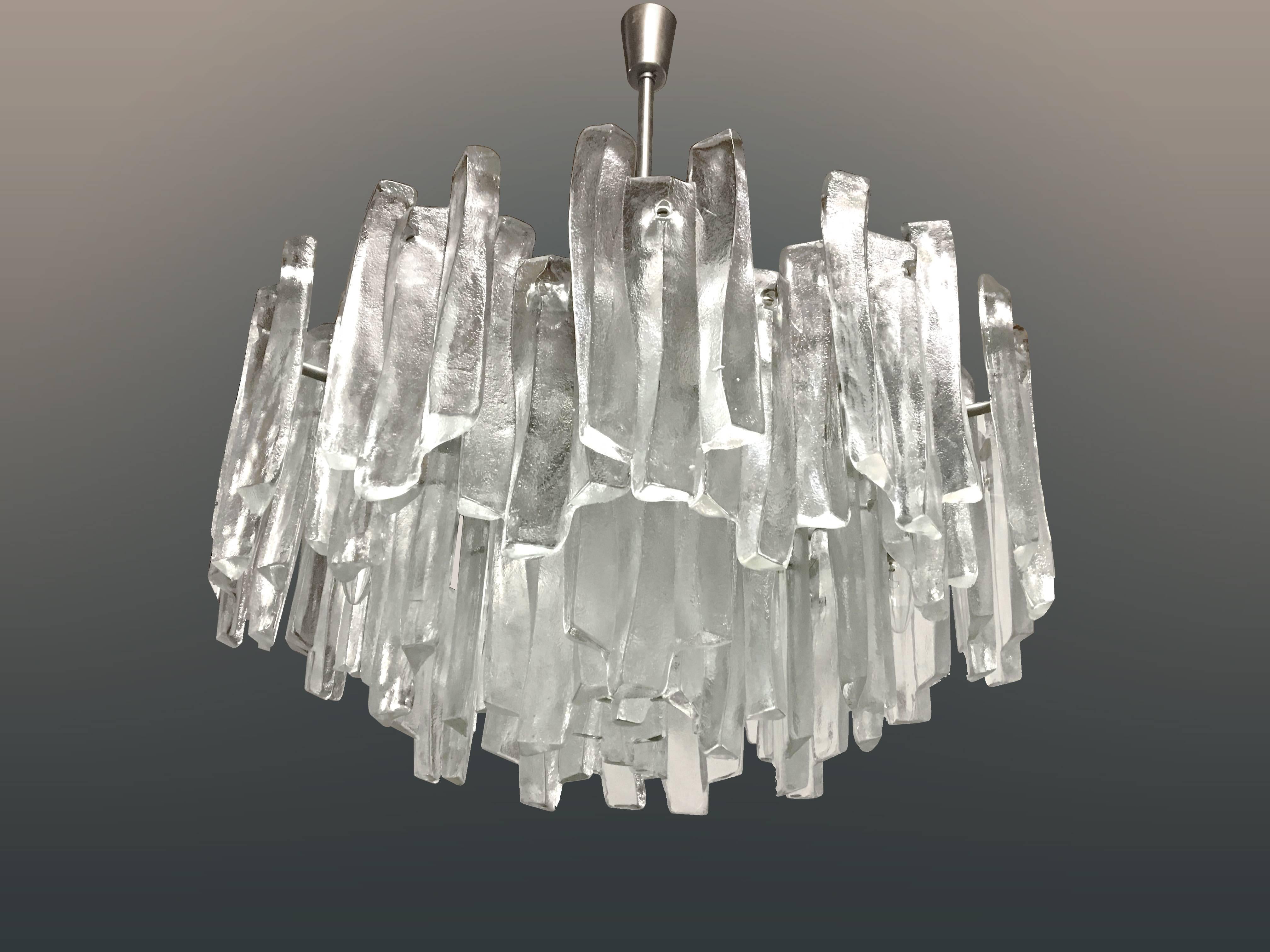A large tiered glass chandelier on a chrome frame by J.T. Kalmar 1972 (very rare).

    