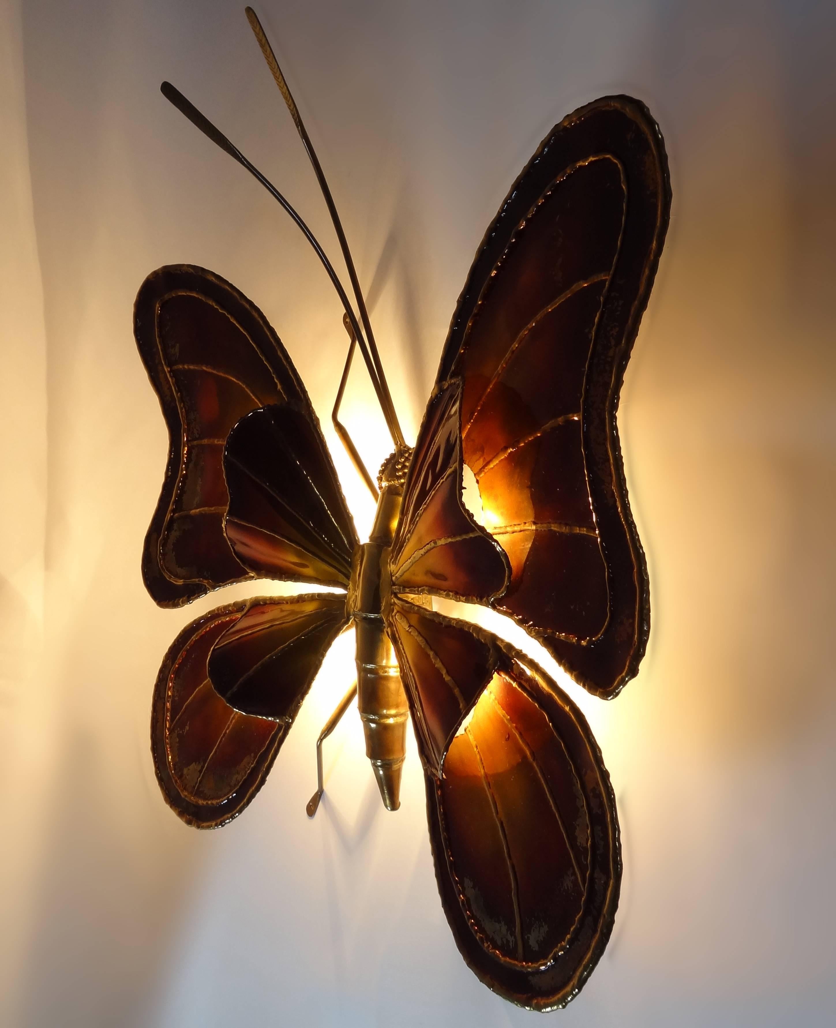 A large colorful brass butterfly sconces.

Belgian, Circa 1970's 

UL Listing Services are available upon request.