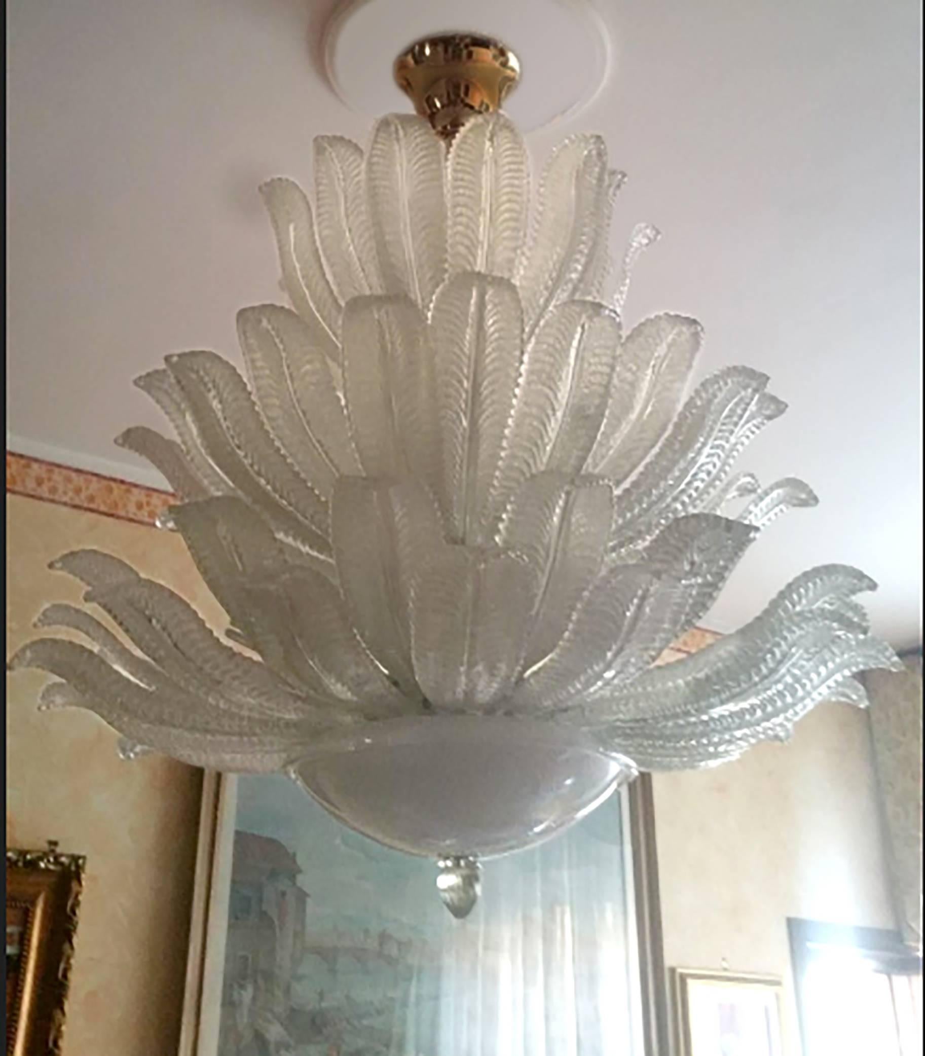A large glass chandelier with brass hardware and canopy with original labels by Aureliano Toso.

Italian, Circa 1980's

Three (2) Chandeliers Are Available.

UL Listing Services are available upon request.