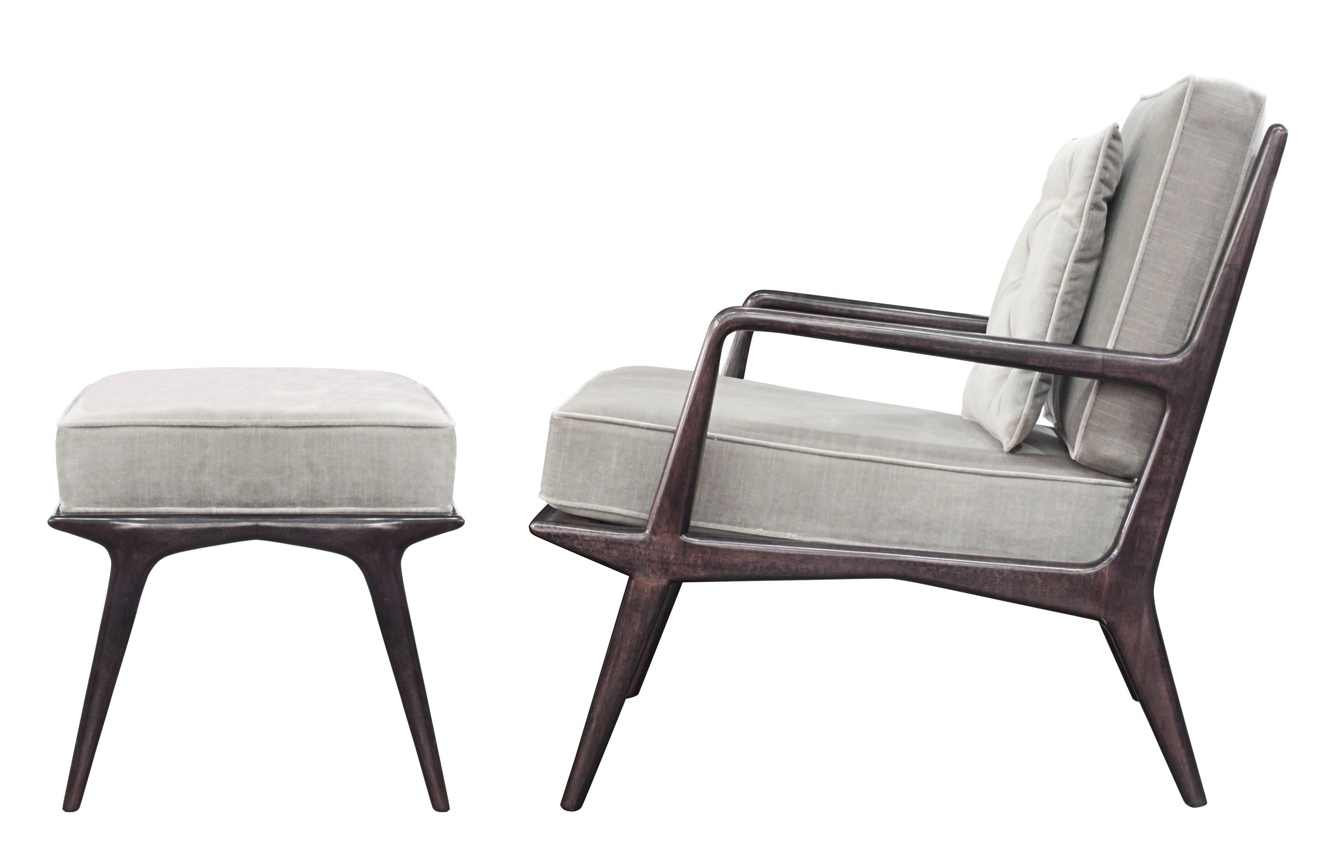 Sculptural lounge chair and ottoman with frame in dark walnut by 
Carlo de Carli for M. Singer & Sons, American 1950s. 
Newly refinished and reupholstered in gray velvet by Lobel Modern. 

The ottoman is 24 1/2 inches wide x 18 inches deep x 17