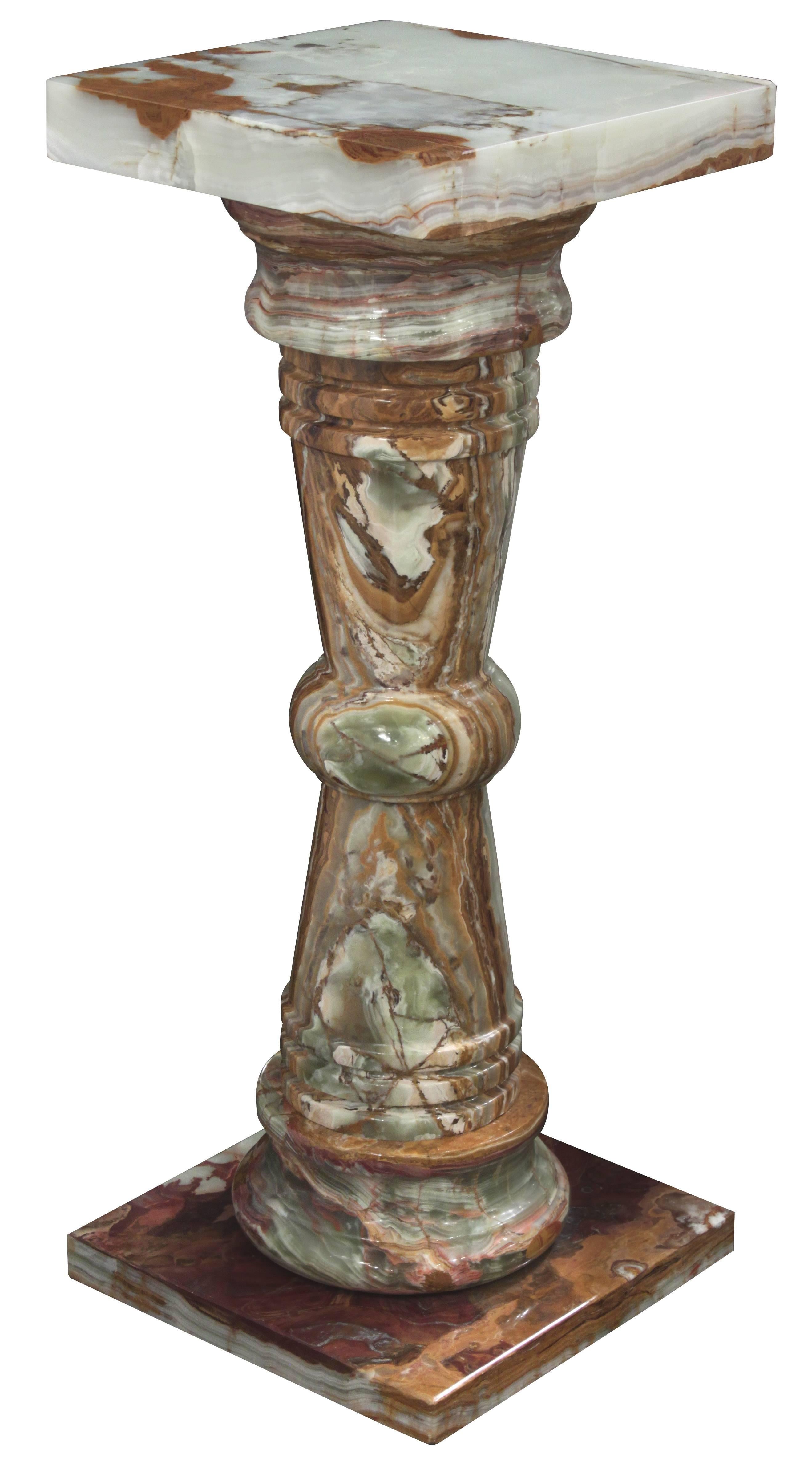 Pedestal in polished green and brown onyx, American, 1970s. 
These are sold individually.