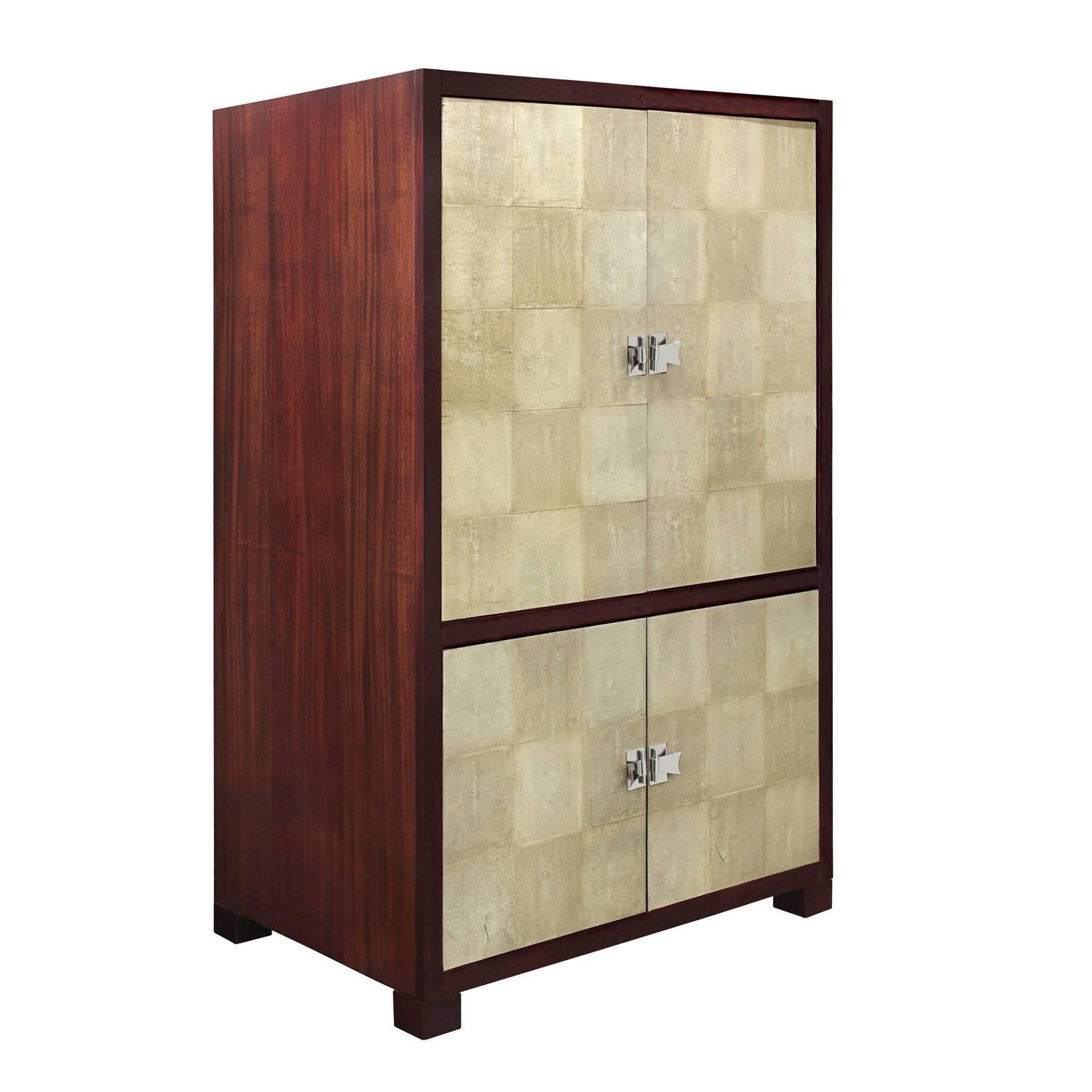 TV cabinet in mahogany with retracting doors covered in shagreen with chrome hardware by Larry Laslo for Widdicomb Furniture, American, 1980s (signed.) This can be refitted to be a wardrobe.