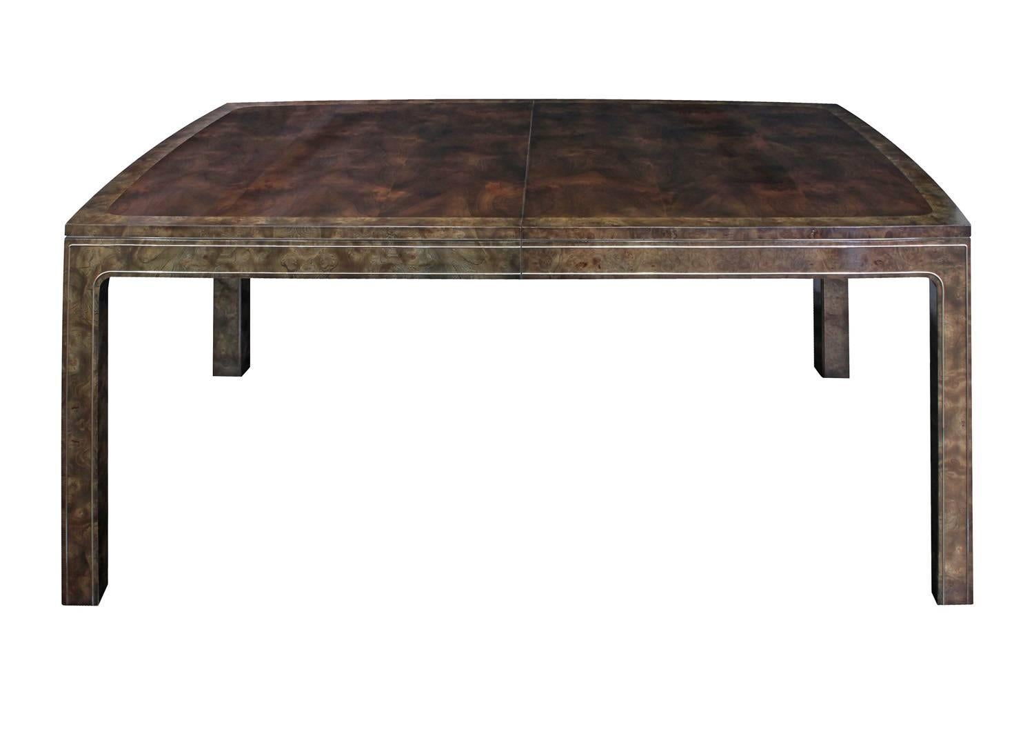 Dining table with two leaves in bookmatched Carpathian elm with brass inlays by Mastercraft, American, 1960s.