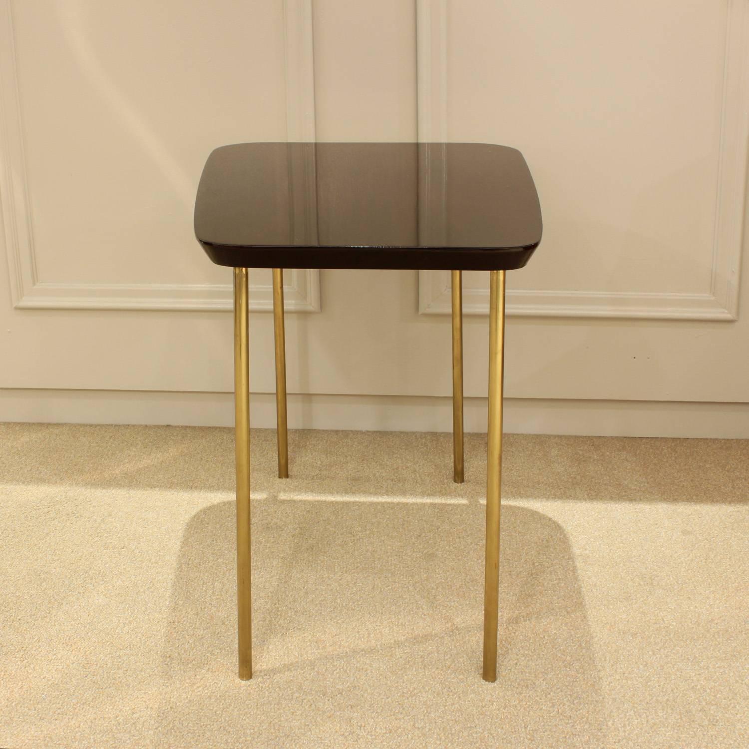 Chic end table in mahogany with brass legs by Charak Modern, American 1940s.
