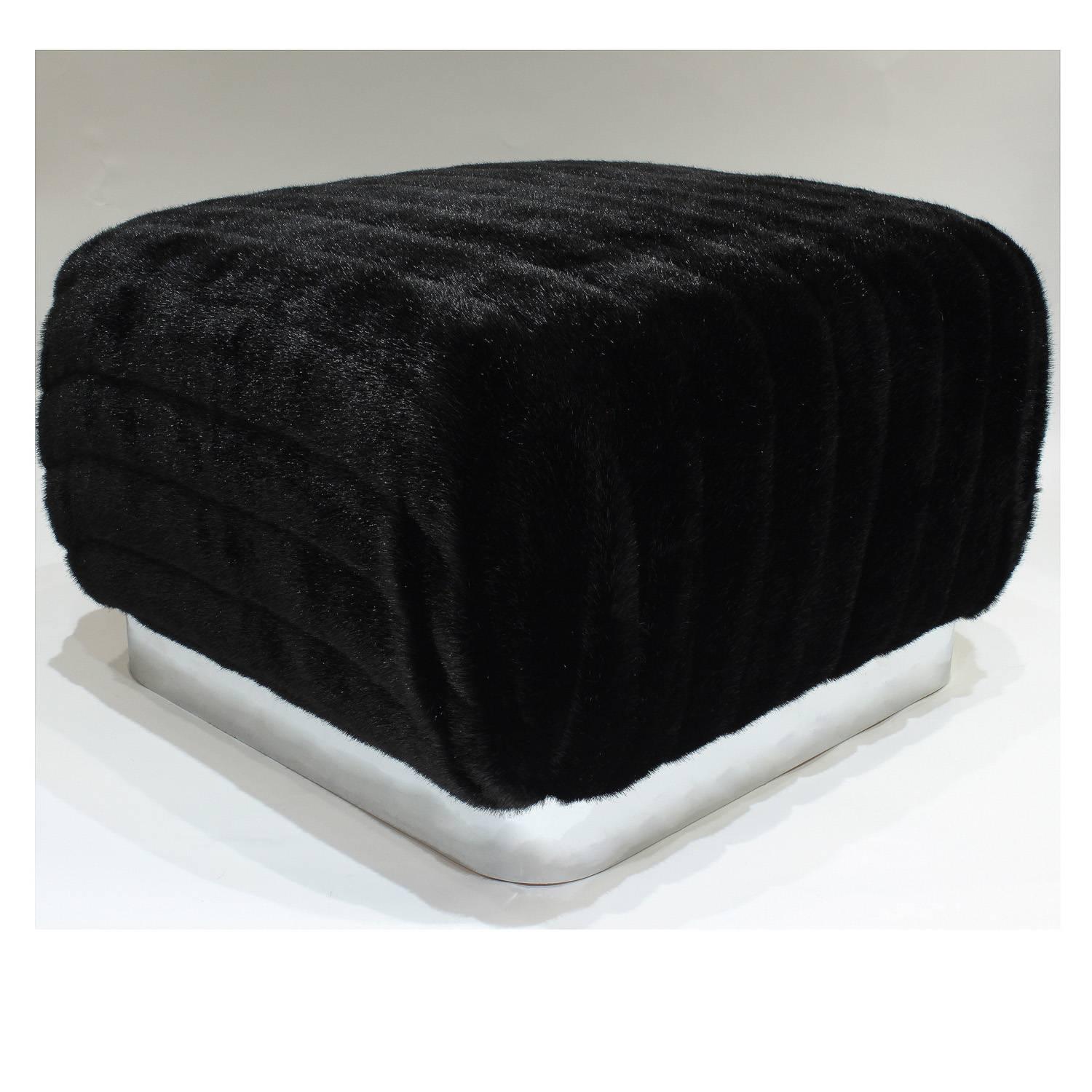 Large square Souffle ottoman newly upholstered in faux mink with ploished steel base by Karl Springer, American, 1970s.