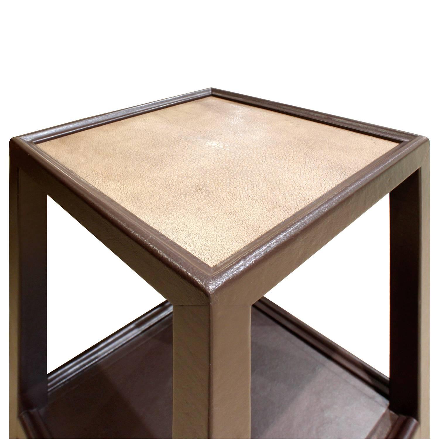 Telephone table shown here in hand-stitched leather with inset shagreen top on polished brass castors designed by Mary Forssberg for Lobel Modern. This table is exceptionally crafted. It can be made in any size and color and in a variety of