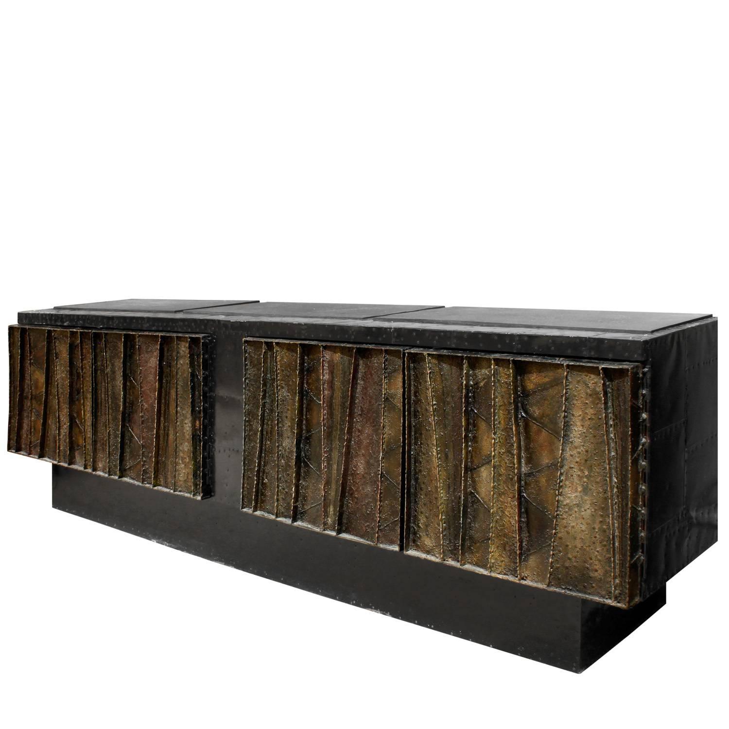 Hand-welded steel "Deep Relief Credenza" with soft luxe coloration on doors and three inset slate slab tops by Paul Evans, American 1970 (signed and dated "Paul Evans 70"). This piece is spectacular. It has rich jewel tones and