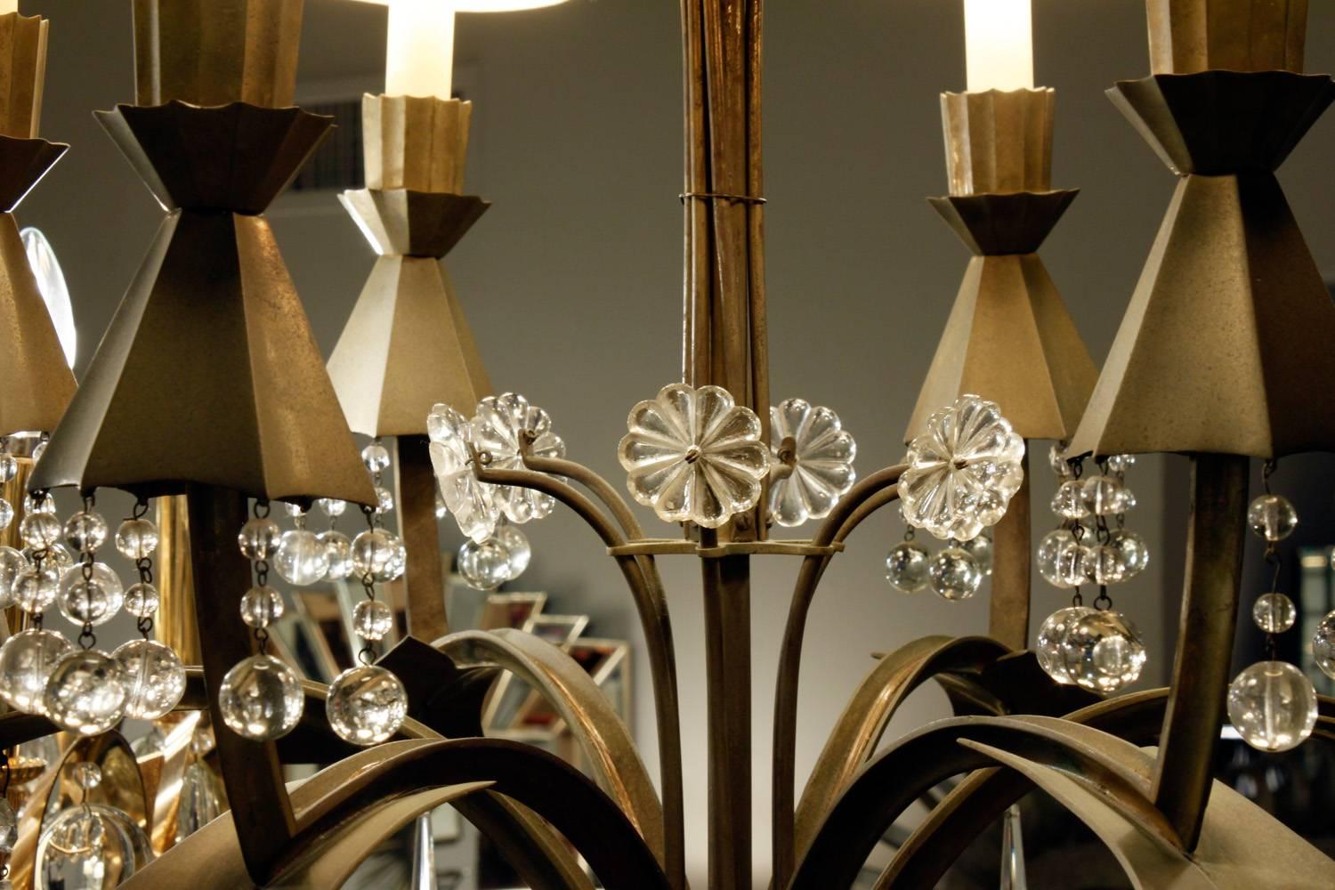 Elegant six-arm chandelier in bronze with crystal decoration, France, 1940s.