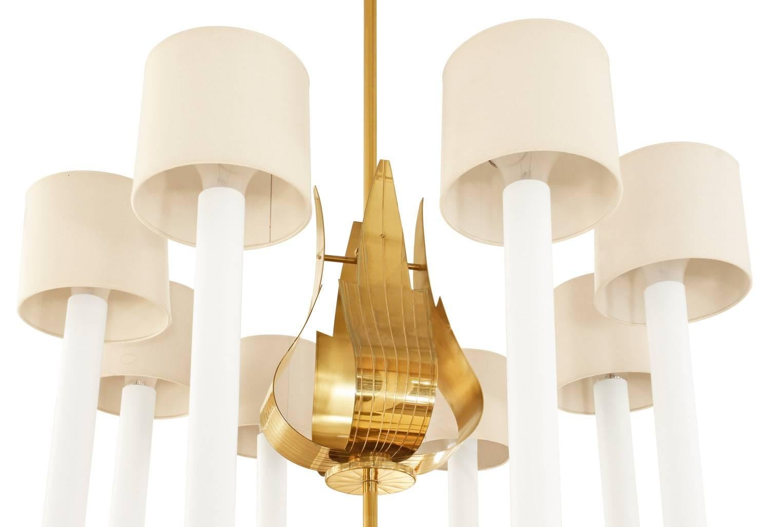 Large eight-arm chandelier in brass with curved leaf motif and down light by Tommi Parzinger for Parzinger Originals, American 1960s. This is an iconic and exceptional Parzinger design.