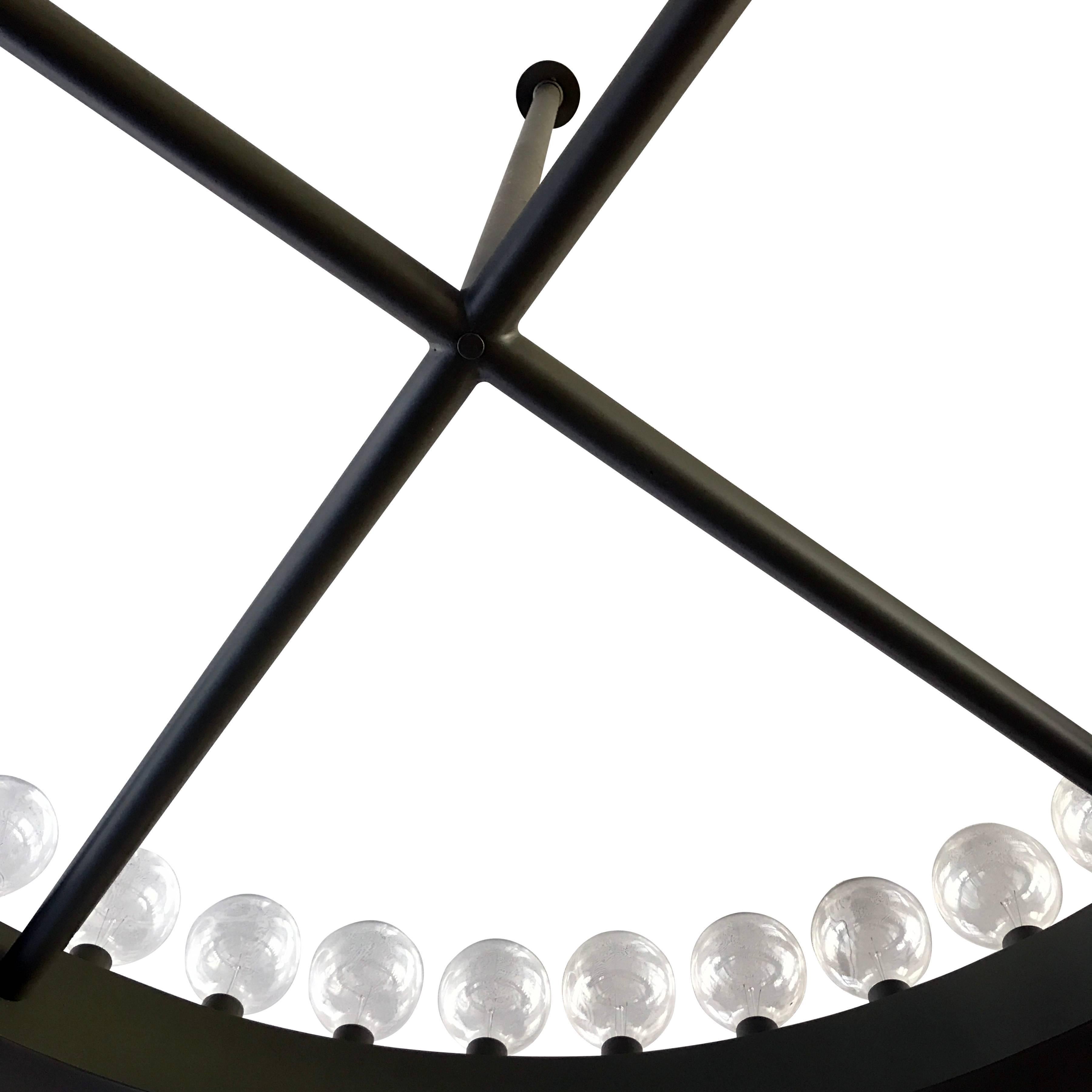 Large round chandeliers (7) in dark steel, each with 36 bulbs, from the original design of Kips Bay Towers by the office of I.M. Pei in 1963. These have been rewired and come with a Letter of Provenance from Kips Bay Towers stating that they were