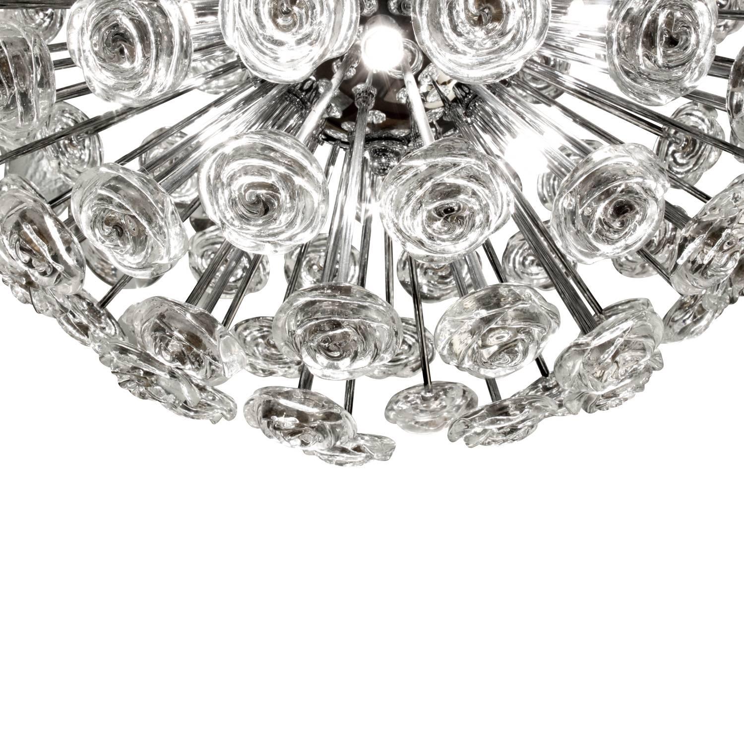 Large sphere chandelier in chrome with molded glass flowers, Sweden, 1960s.
Diameter of chandelier is 28 inches. It hangs on an adjustable cable which can accommodate almost any drop.