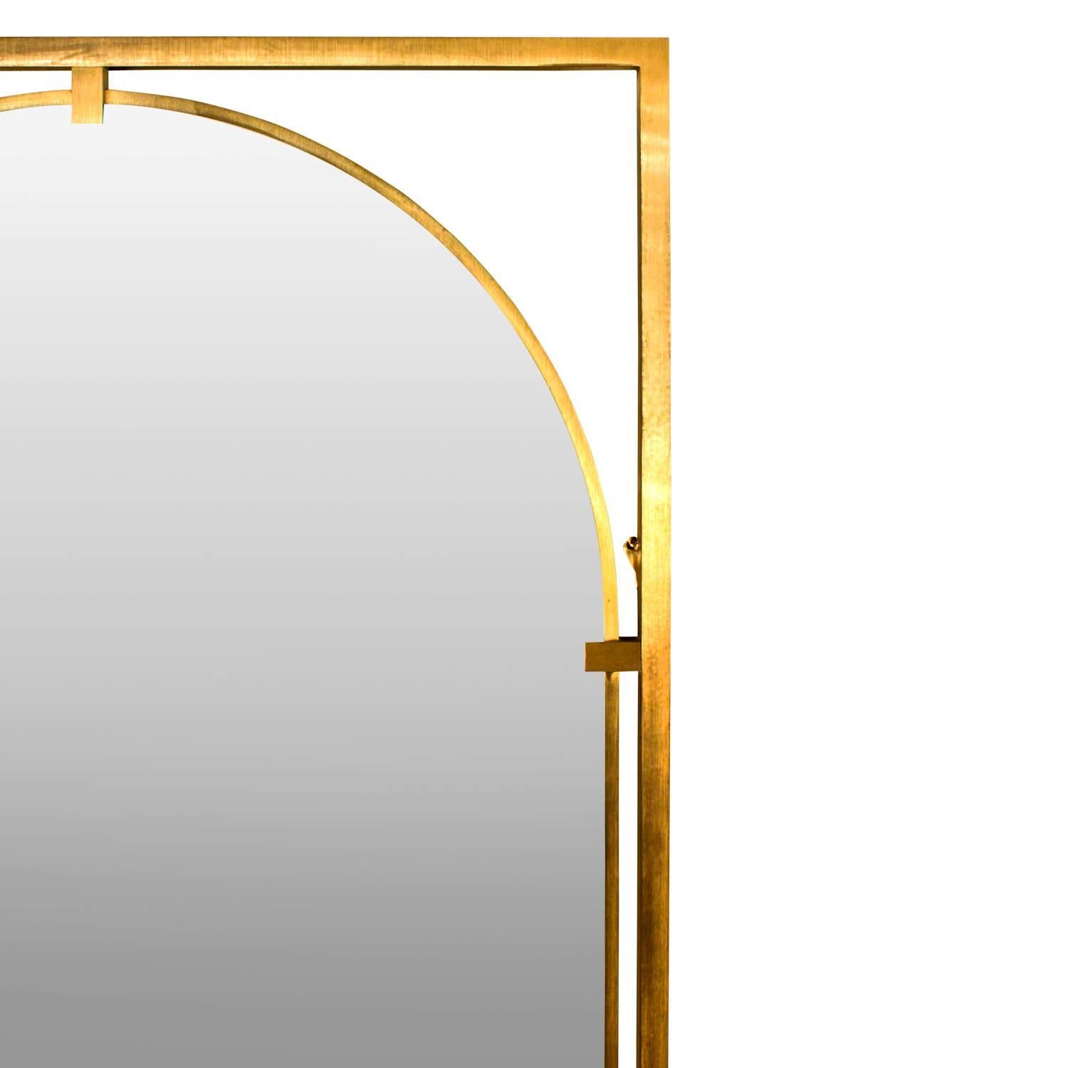 Wall hanging mirror with frame in brass and arc top design by John Widdicomb, American, 1960s.