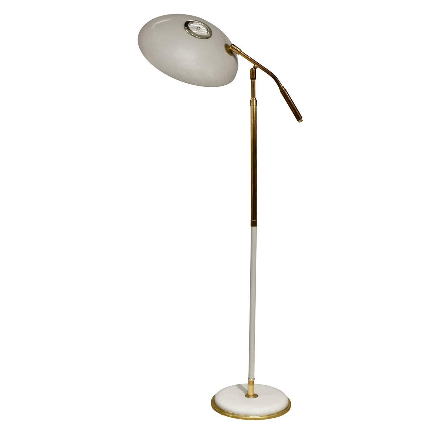 Chic articulating reading lamp in brass with ivory lacquer and bulb diffuser by Gerald Thurston for Lightolier, American, 1950s.
 
