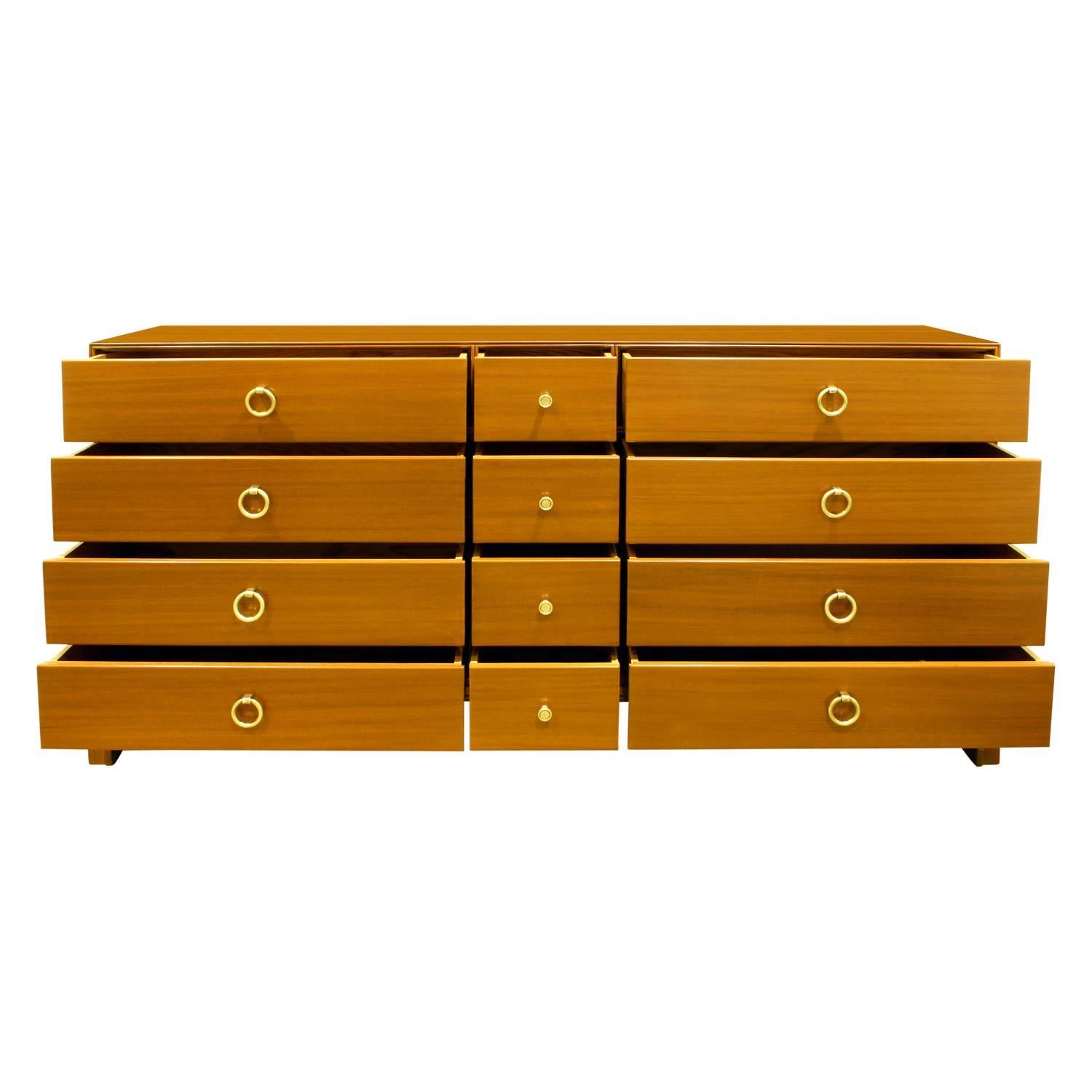 Chest of drawers TP-104 with 12 drawers in mahogany with brass ring pulls by Tommi Parzinger for Charak Modern, American, 1940s (signed in drawer, “Charak Modern”) This is an elegant Parzinger design.