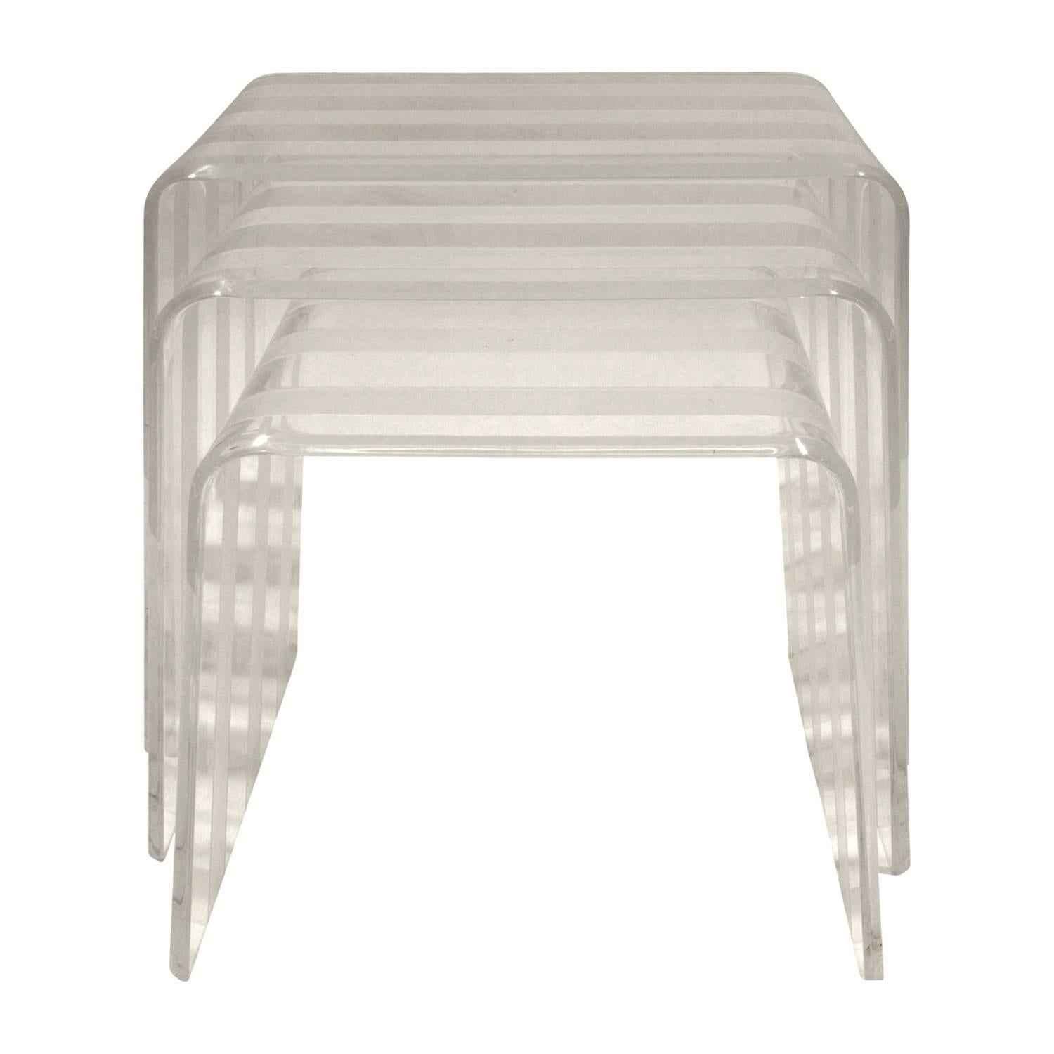 Set of three nesting table in alternating clear and sandblasted Lucite, American, 1970s.