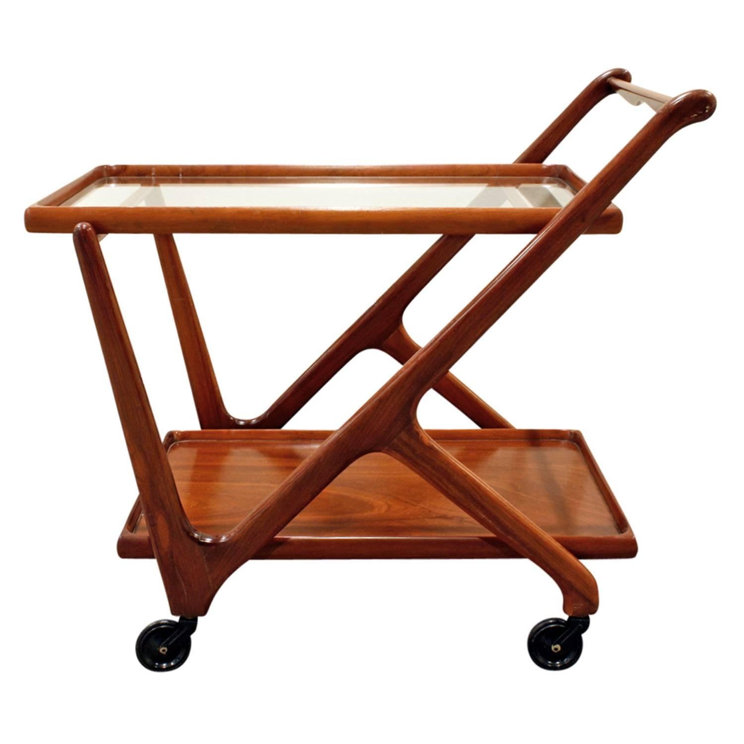 Rolling serving cart in lacquered mahogany with glass by Cesare Lacca (Italy) for Cassina, American, 1970s.  This cart is very stylish and beautifully made.