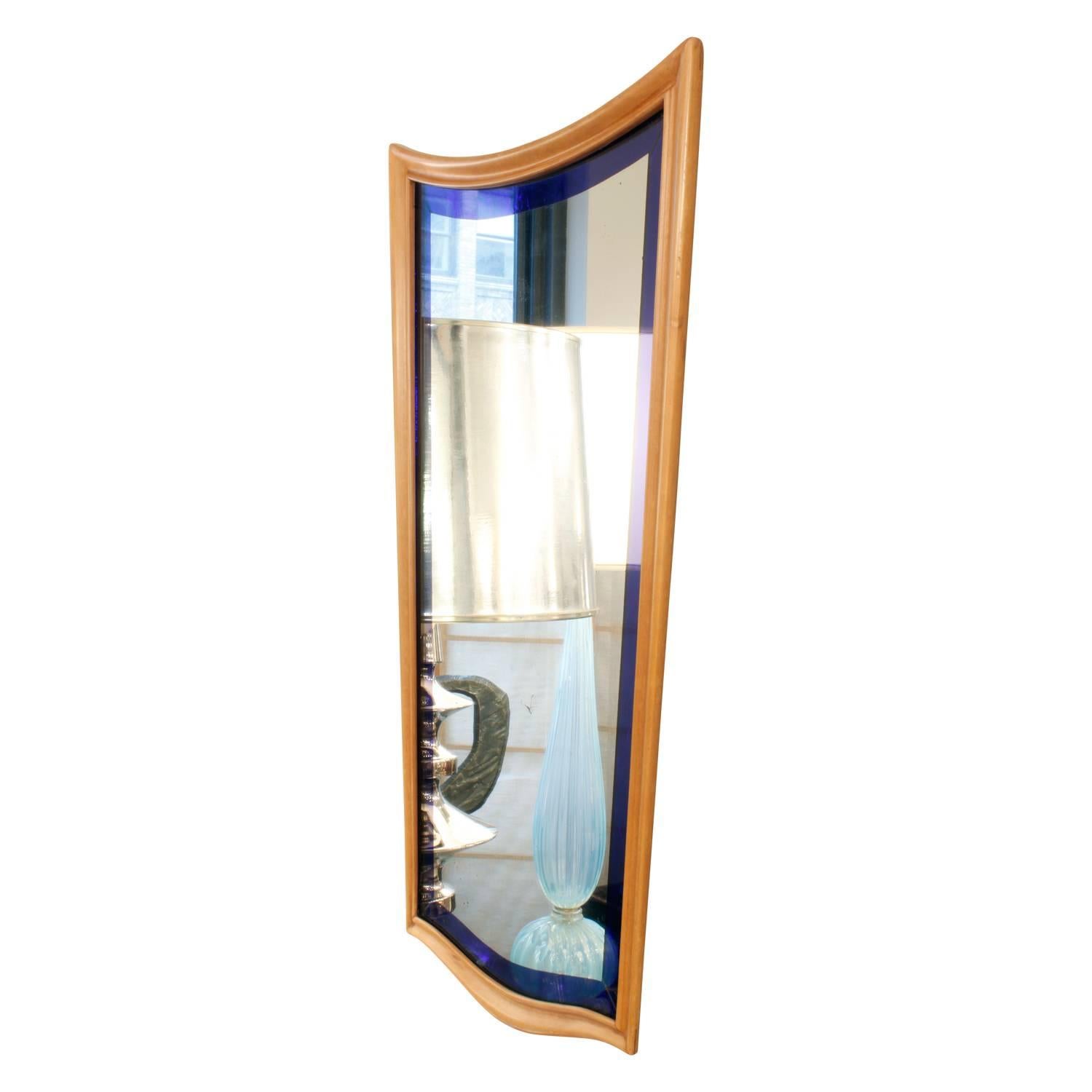 Stylish Art Deco wall-hanging mirror with frame in light maple wood frame with blue glass, Italy, 1930s.