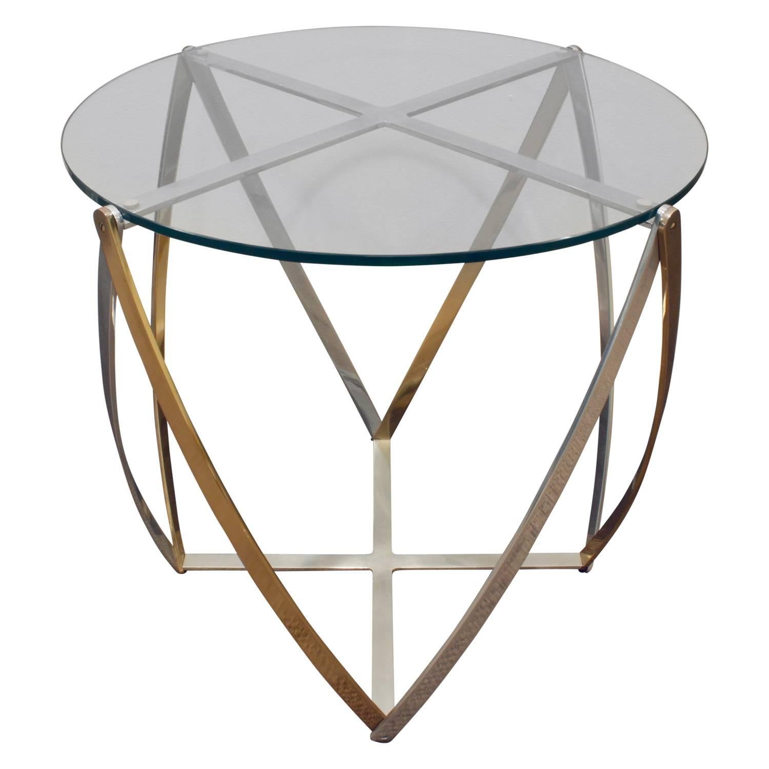 Sculptural end table in brass and brushed aluminum with inset glass top by John Vesey, American 1970's. This combination of metals is very chic.