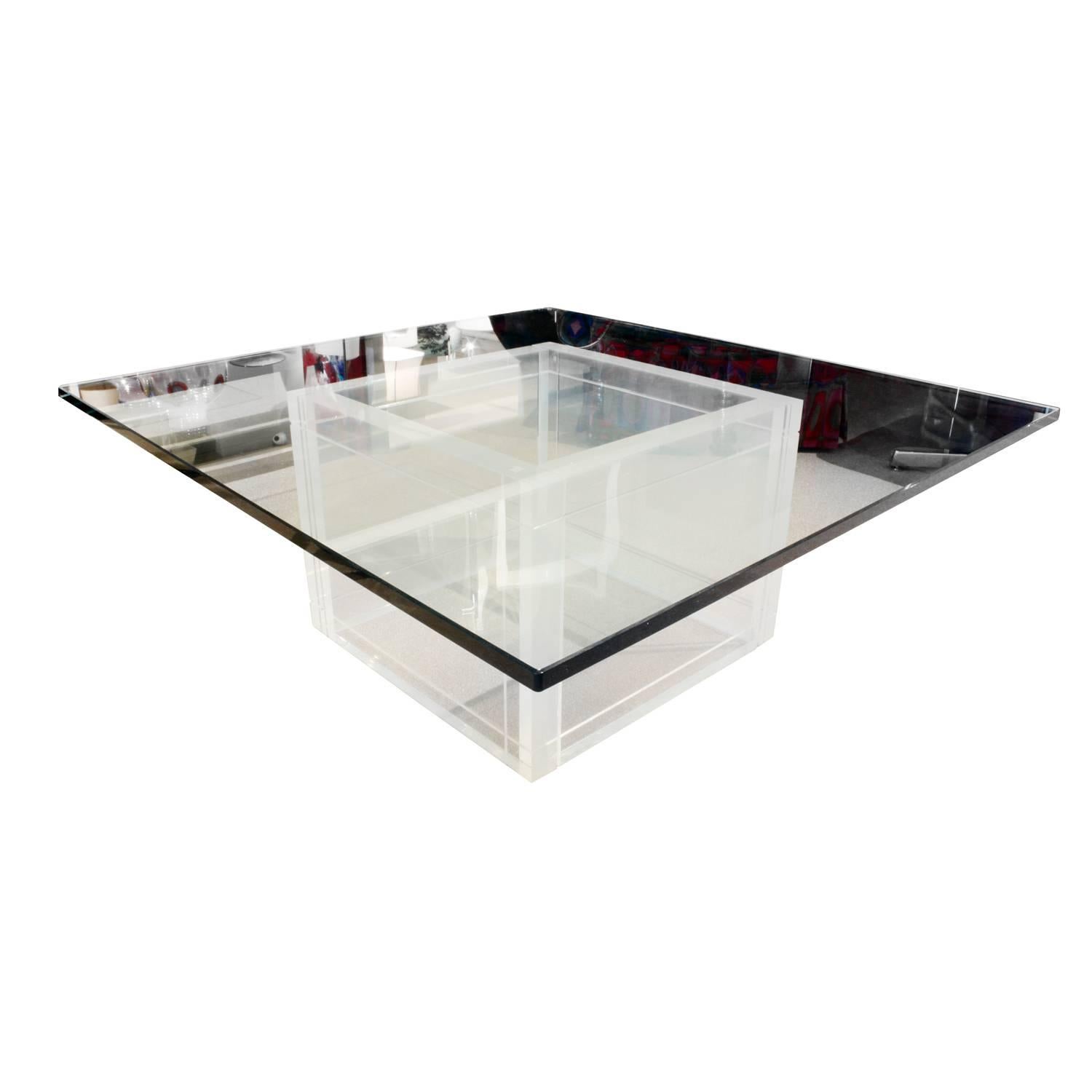 Coffee table with thick Lucite square base with thick glass top, American, 1970s. This is a chic design.