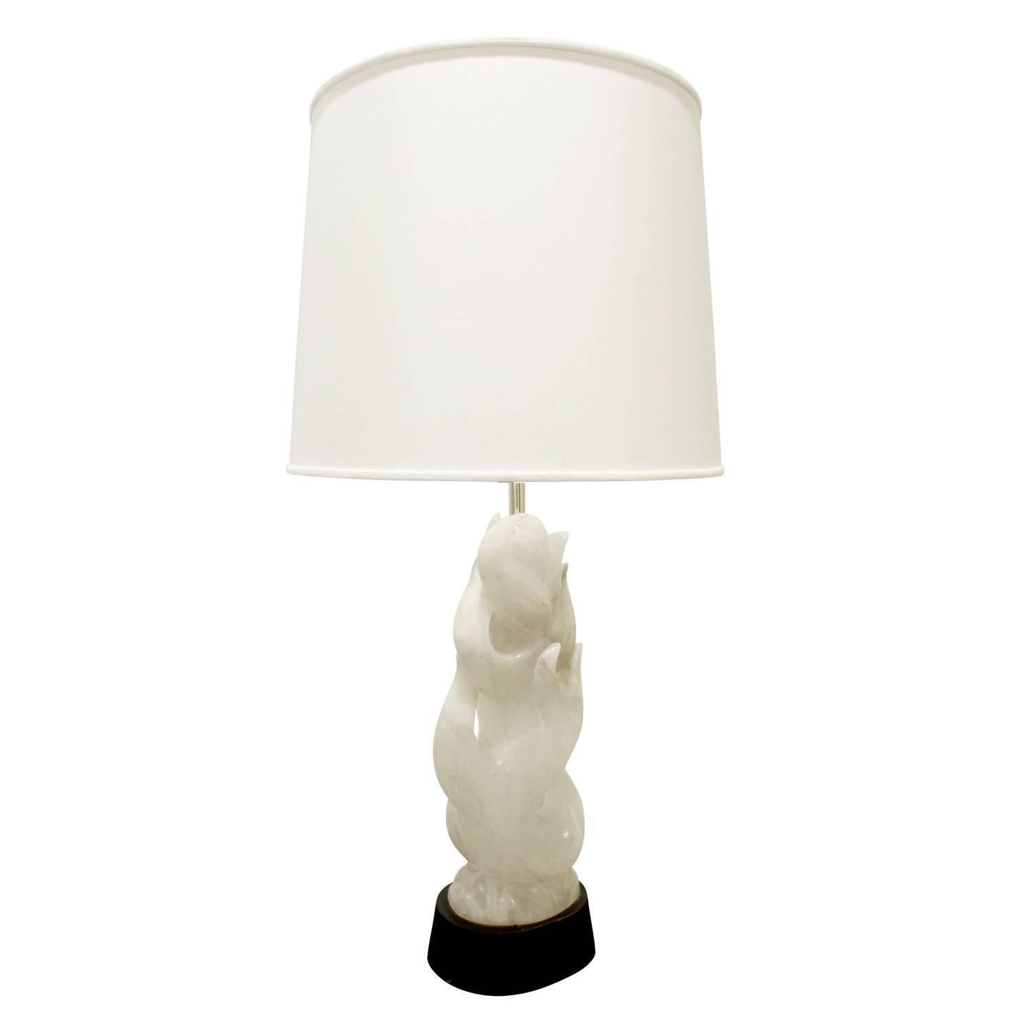Hand-carved alabaster table lamp with flame motif on an ebonized base, Italian, 1940s. Newly wired with new socket.