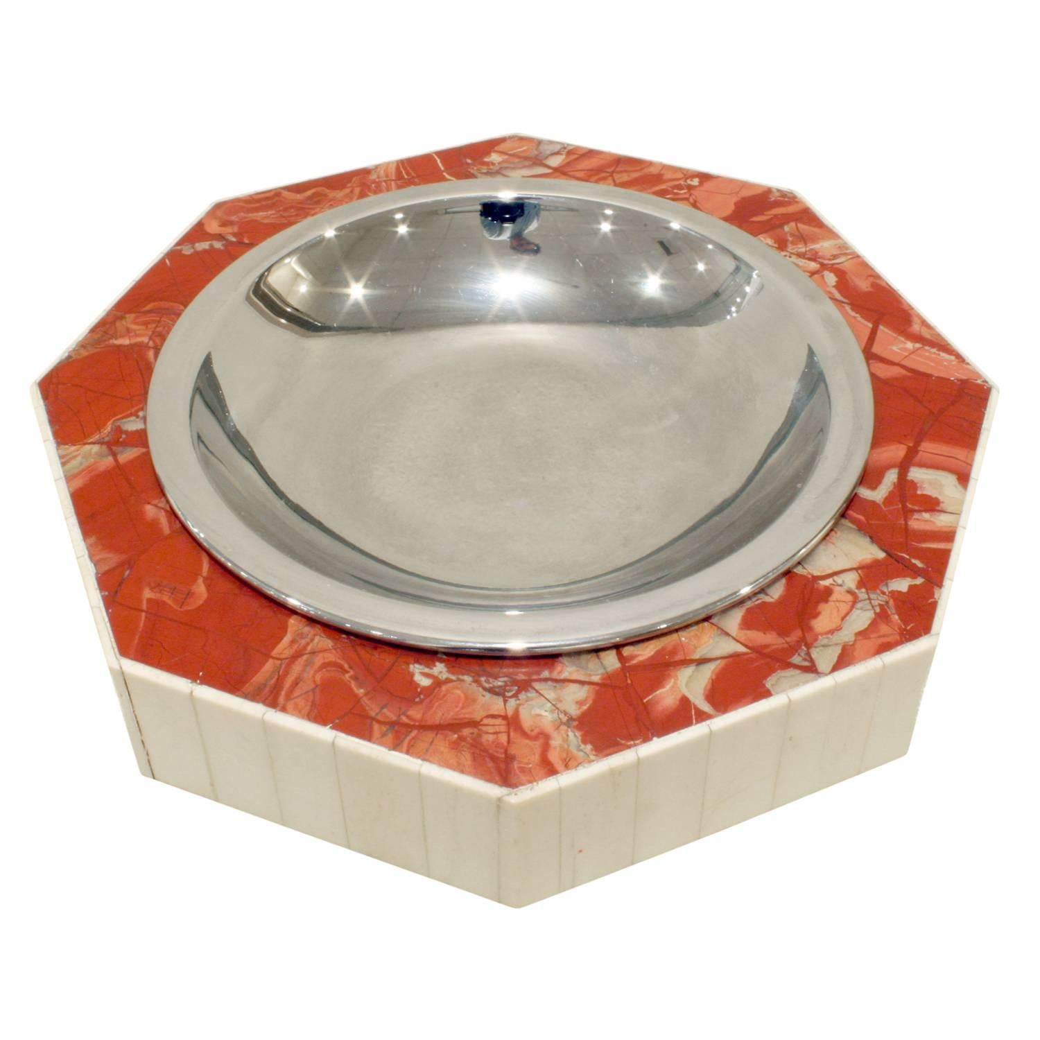Decorative bowl in tessellated red marble with bone around the outside and chrome center along with felt bottom by Jonson & Marcius, American, 1970s (label on bottom 