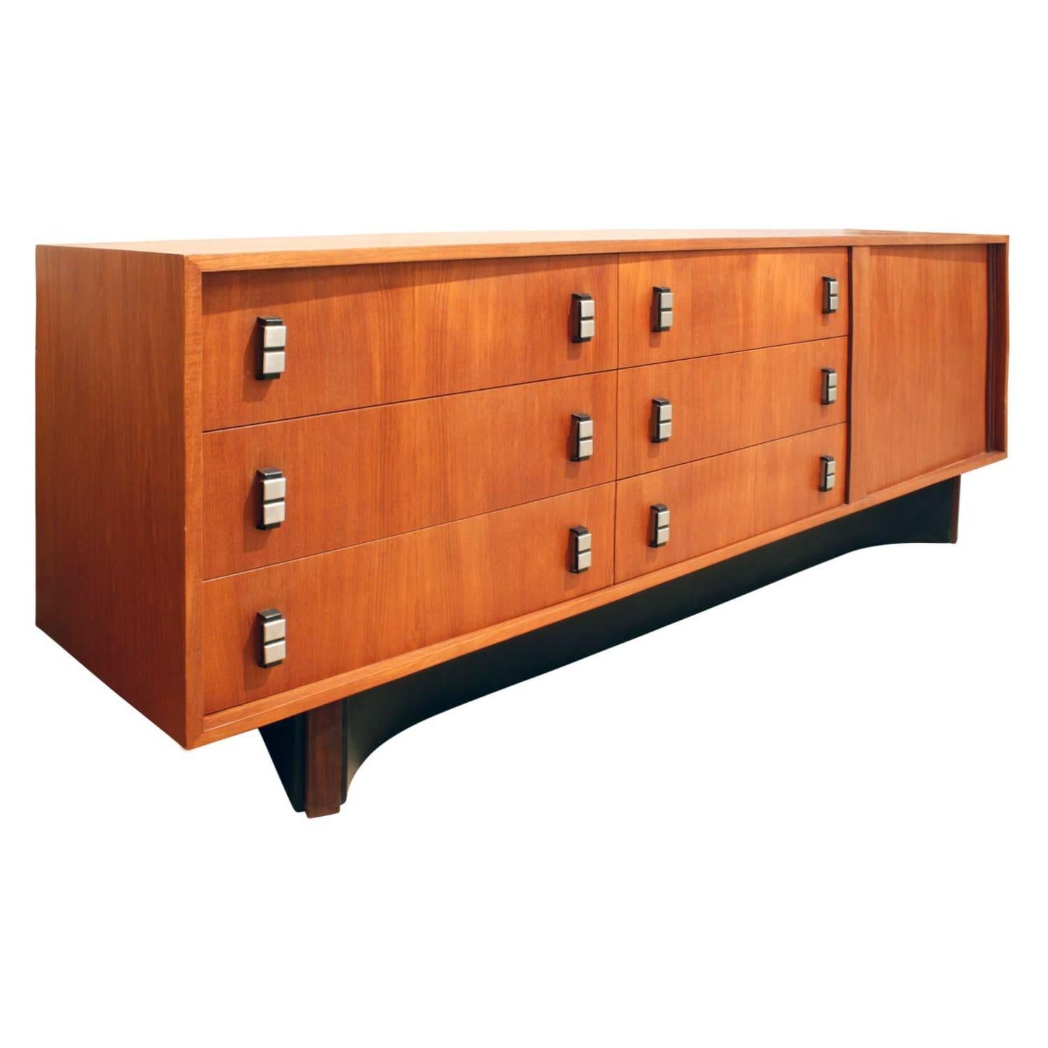Credenza in teak with tambour door, steel pulls and leather wrapped sculptural base by RS Associates Ltd, Canada, 1960s.