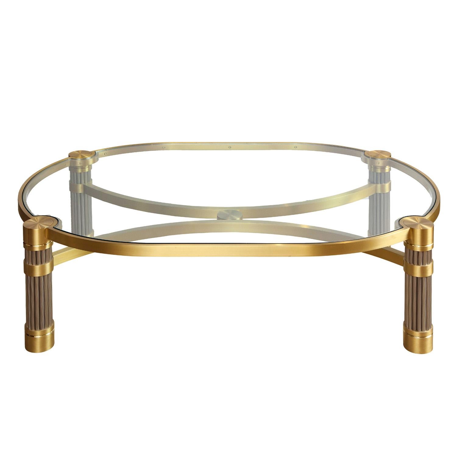 Meticulously crafted large coffee table in brushed stainless steel and gold tinted brass with inset glass top by Ron Seff, American 1980's.  Ron Seff was an acolyte of Karl Springer.  This coffee table is very refined and crafted to the highest