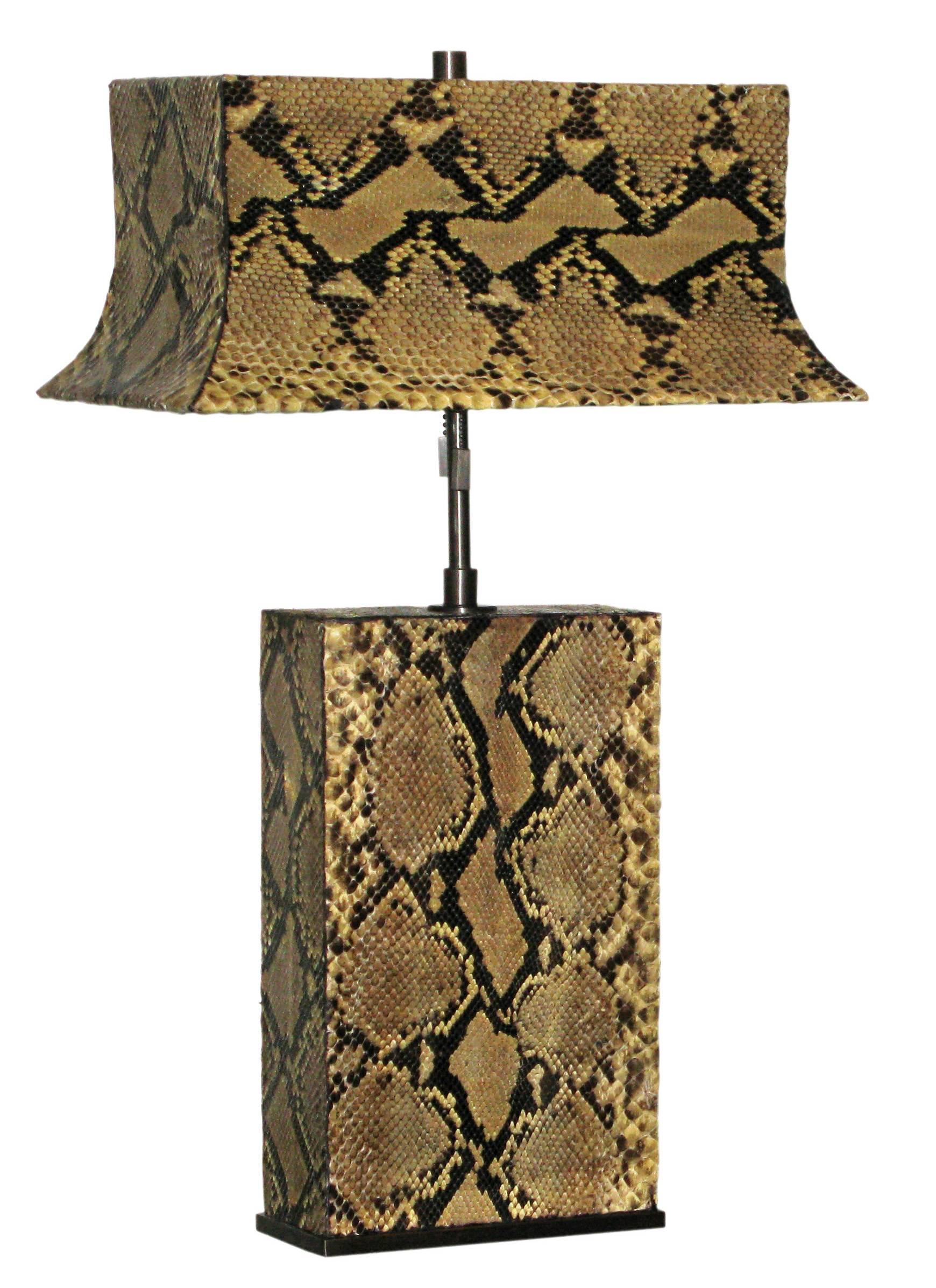 Exceptional pair of table lamps in bronze, with lamps and shades covered in python, designed by Karl Springer, American, 1977
(metal label on shade reads “Karl Springer 1977”).