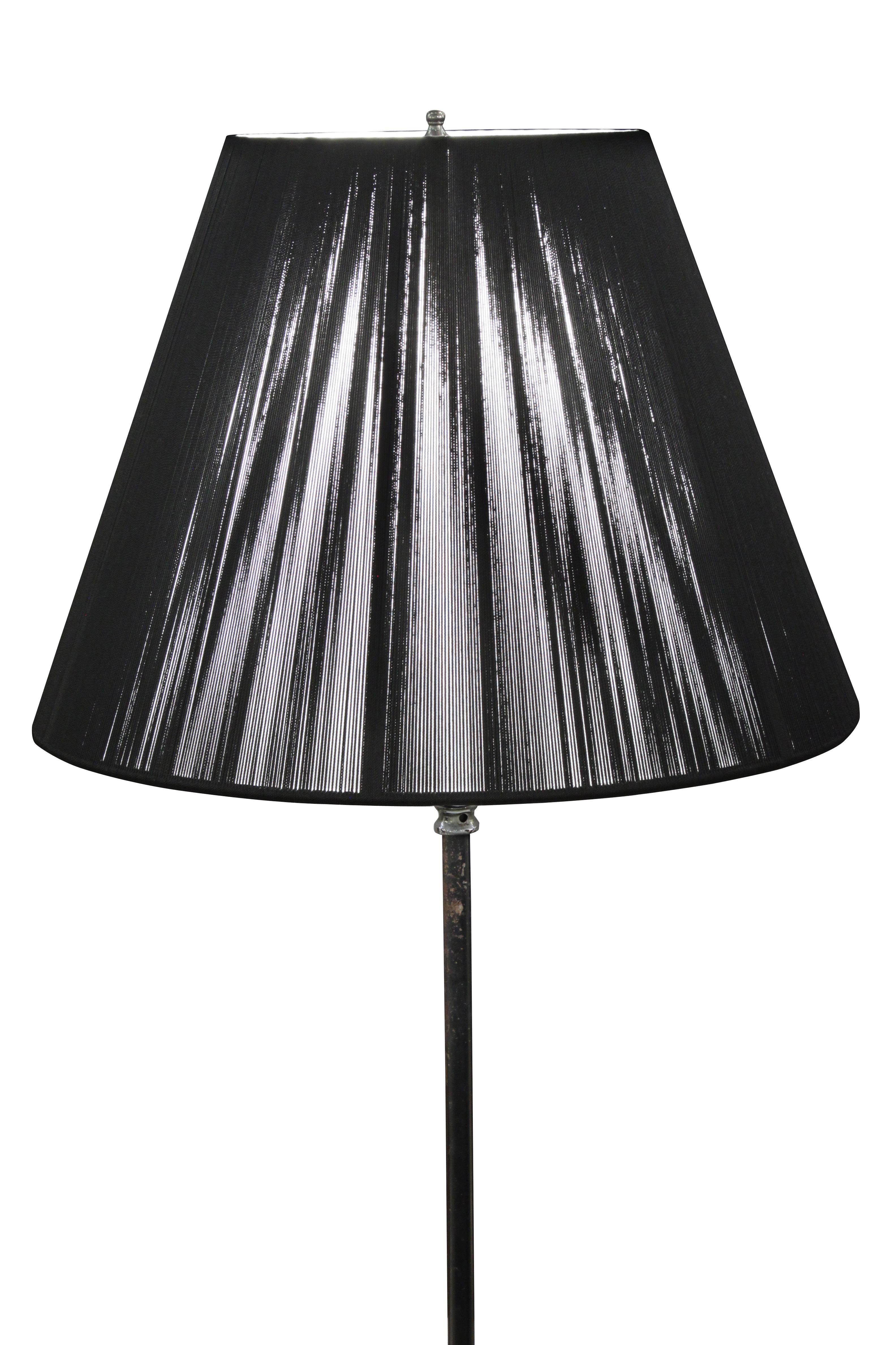 Elegant three-leg black metal floor lamp with incised nickel accents, France, 1950s.
