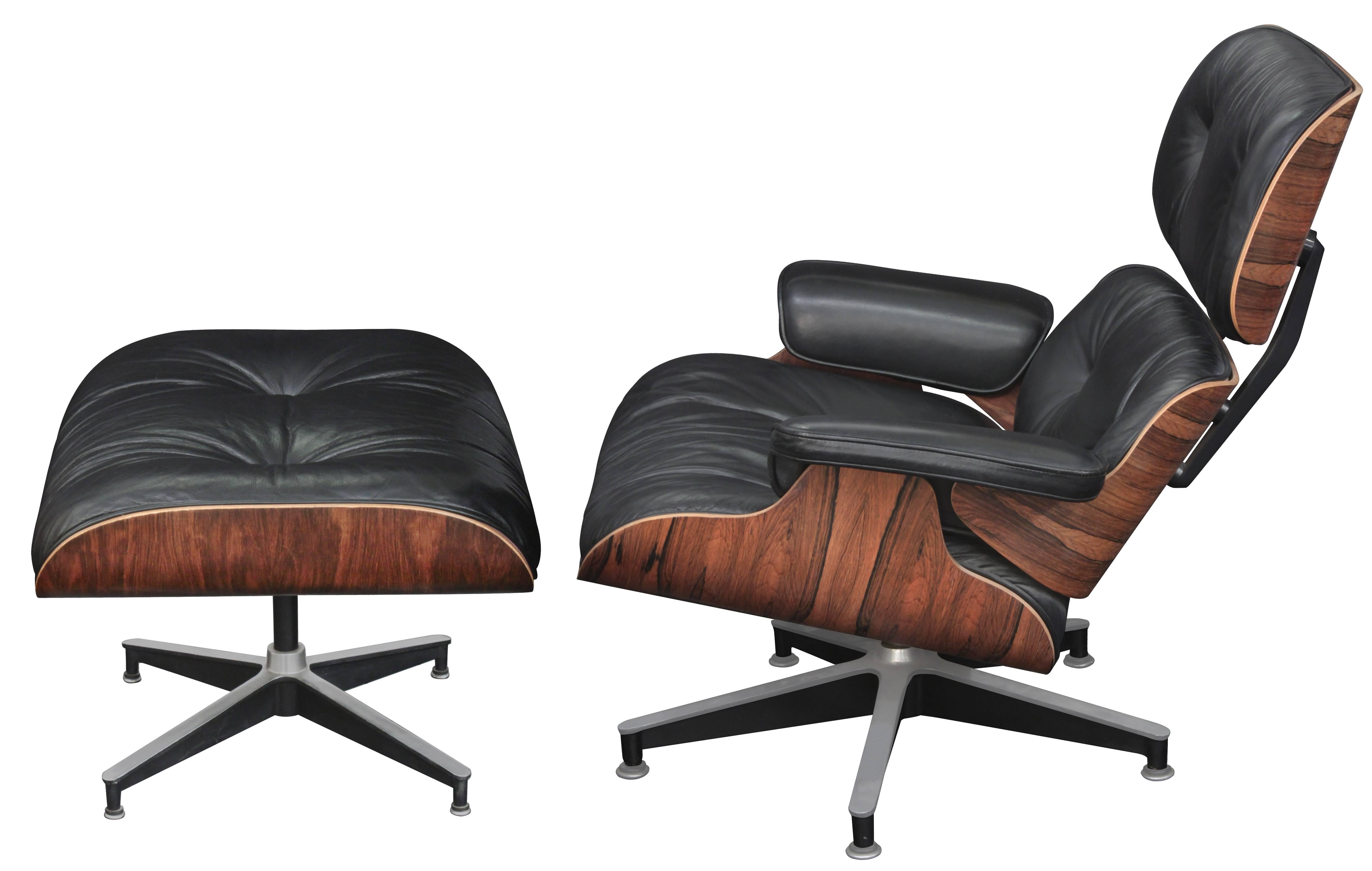 Iconic lounge chair and ottoman model numbers 670 and 671 in rosewood with black leather by Charles and Ray Eames for Herman Miller, American 1981. Ottoman is 25 1/2 inches wide x 20 1/2 inches deep x 16 inches high.