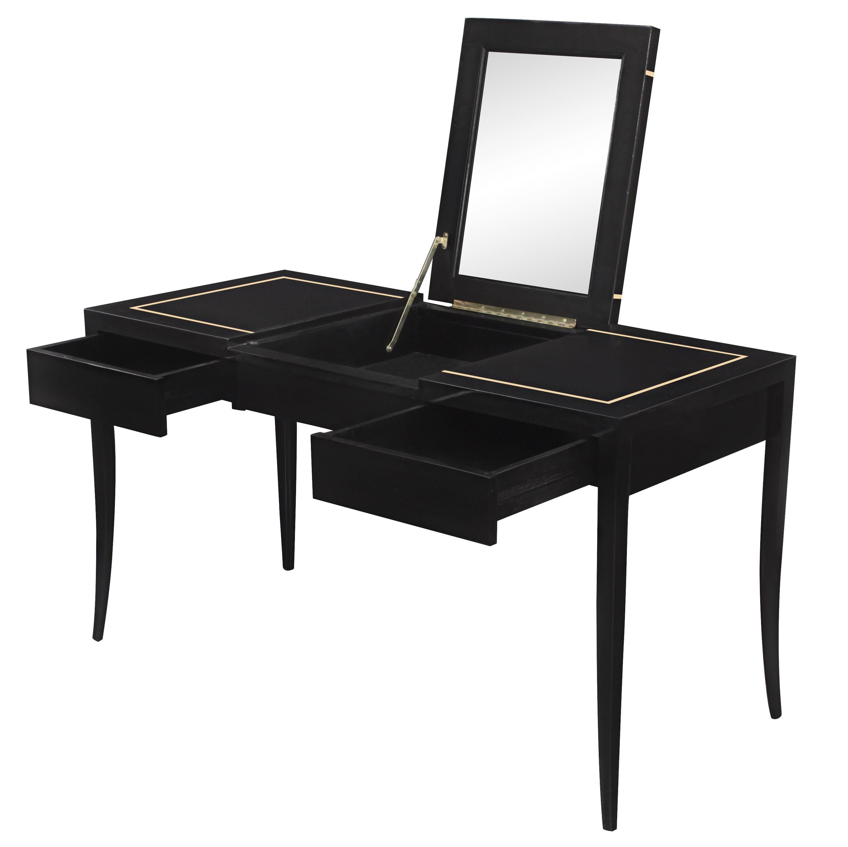 Elegant lady's vanity model no. #303, ebonized with gold inlay with flip up mirror top, by Tommi Parzinger for Parzinger Originals, American, 1950s.
 