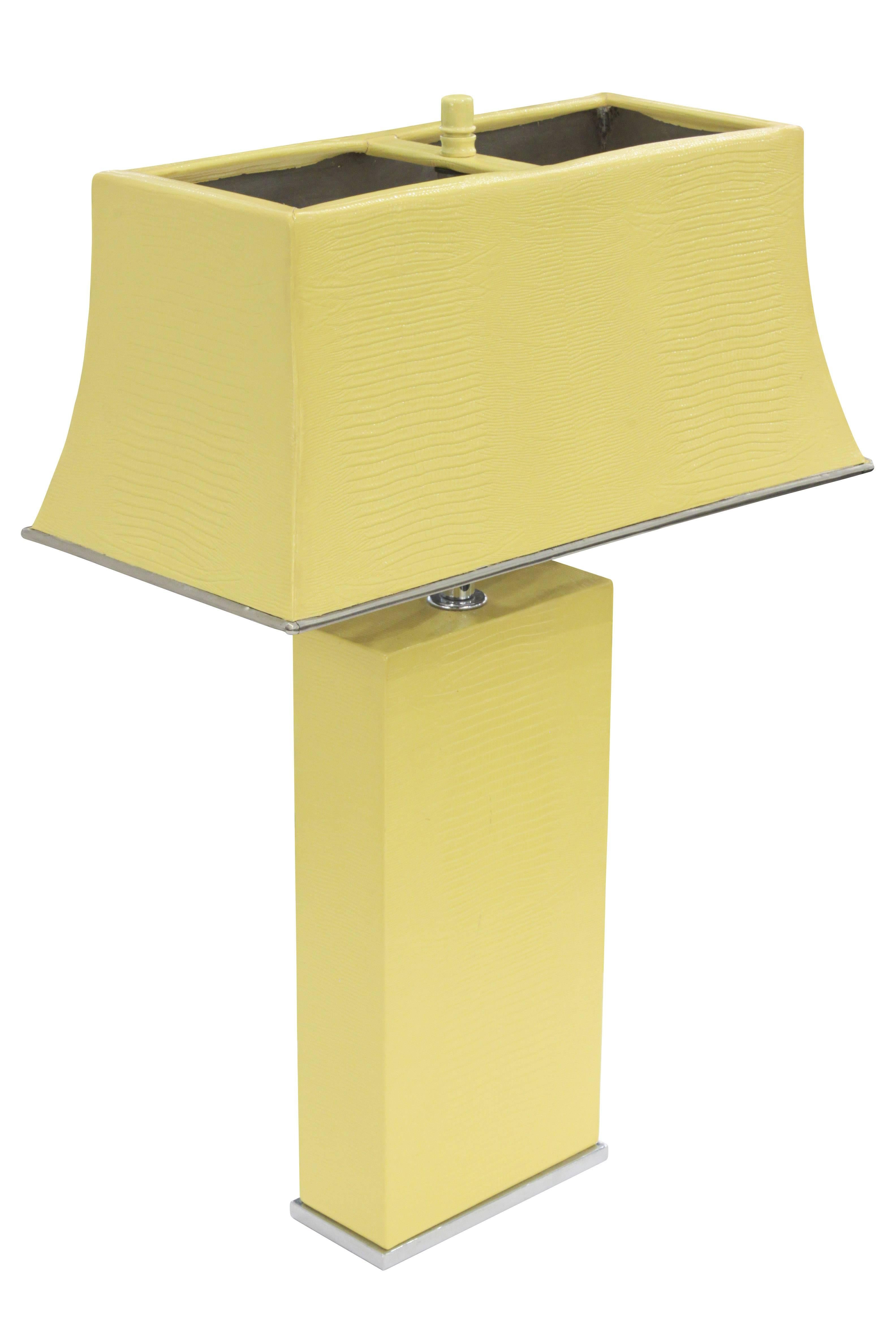 Exceptional table lamp with shade, both in steel clad in yellow embossed lizard leather, by Karl Springer, American 1974. Height is adjustable from 22” to 26”.
 