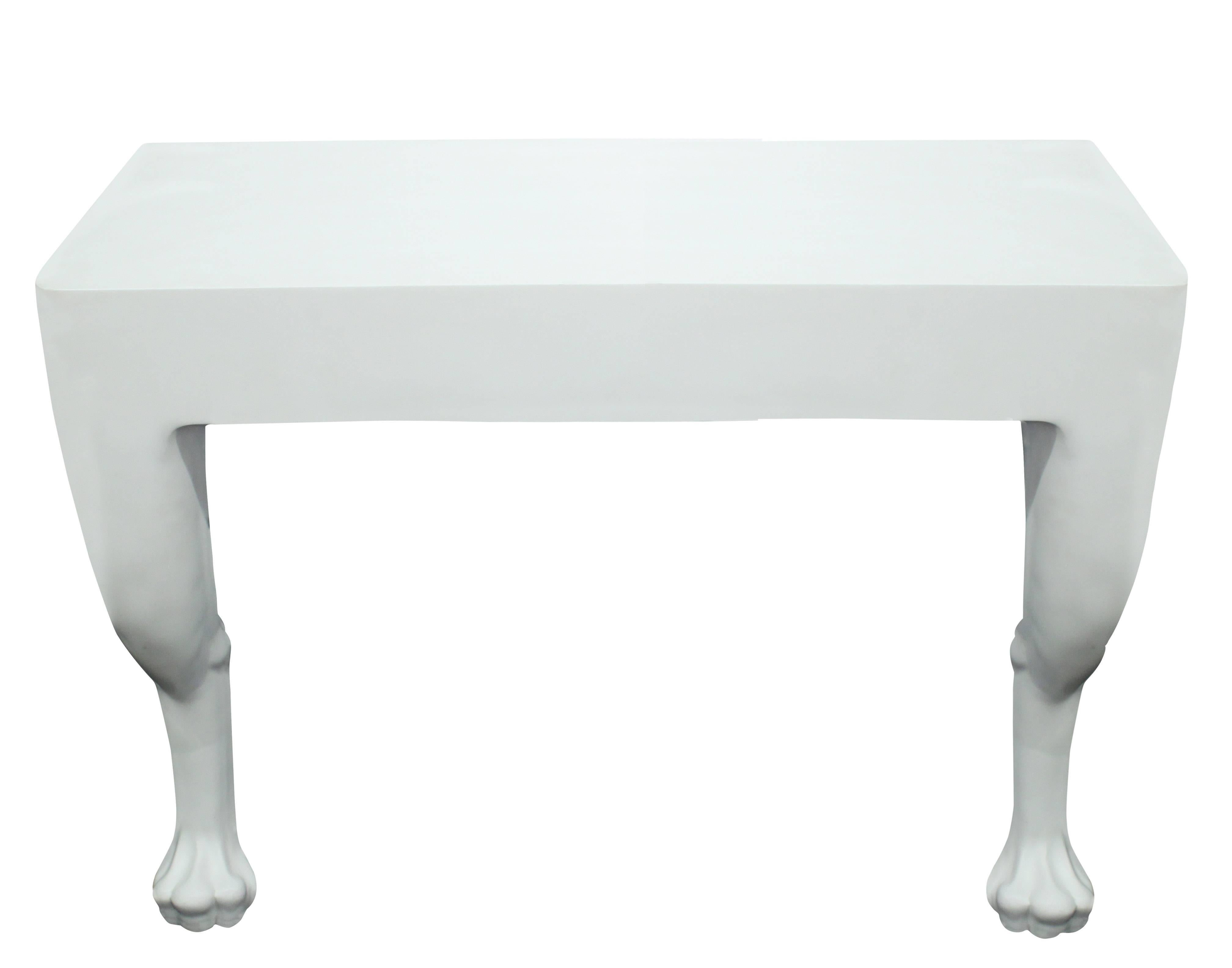 Wall-mounted console table in resin with paws on front legs in the manner of John Dickinson, American, 1980s. This is an exact copy of the original and is indistinguishable. It was made by a resin fabricator in the 1980s.