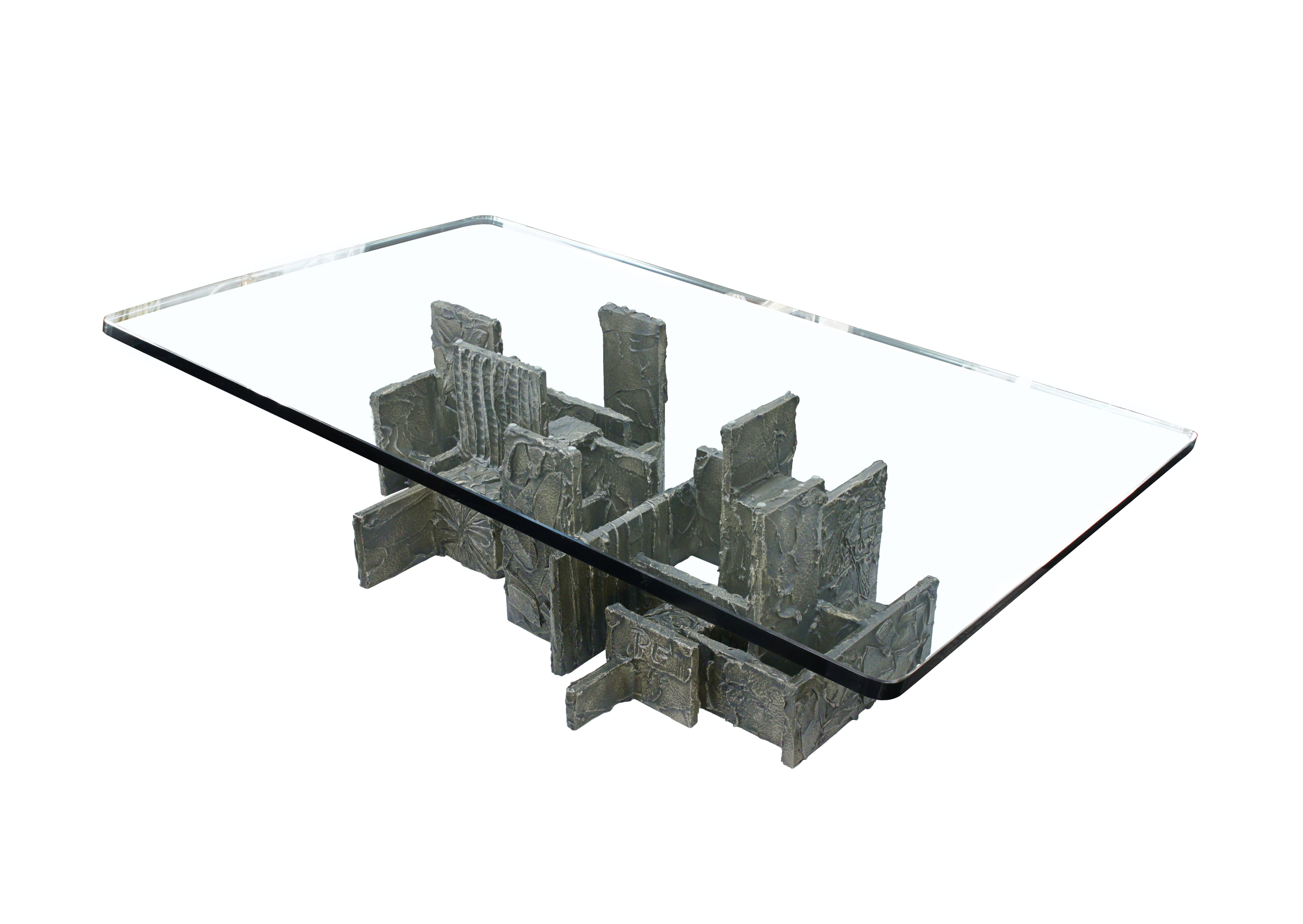 Coffee table with base in sculpted bronze resin with thick glass top by Paul Evans, American 1971 (initialed 