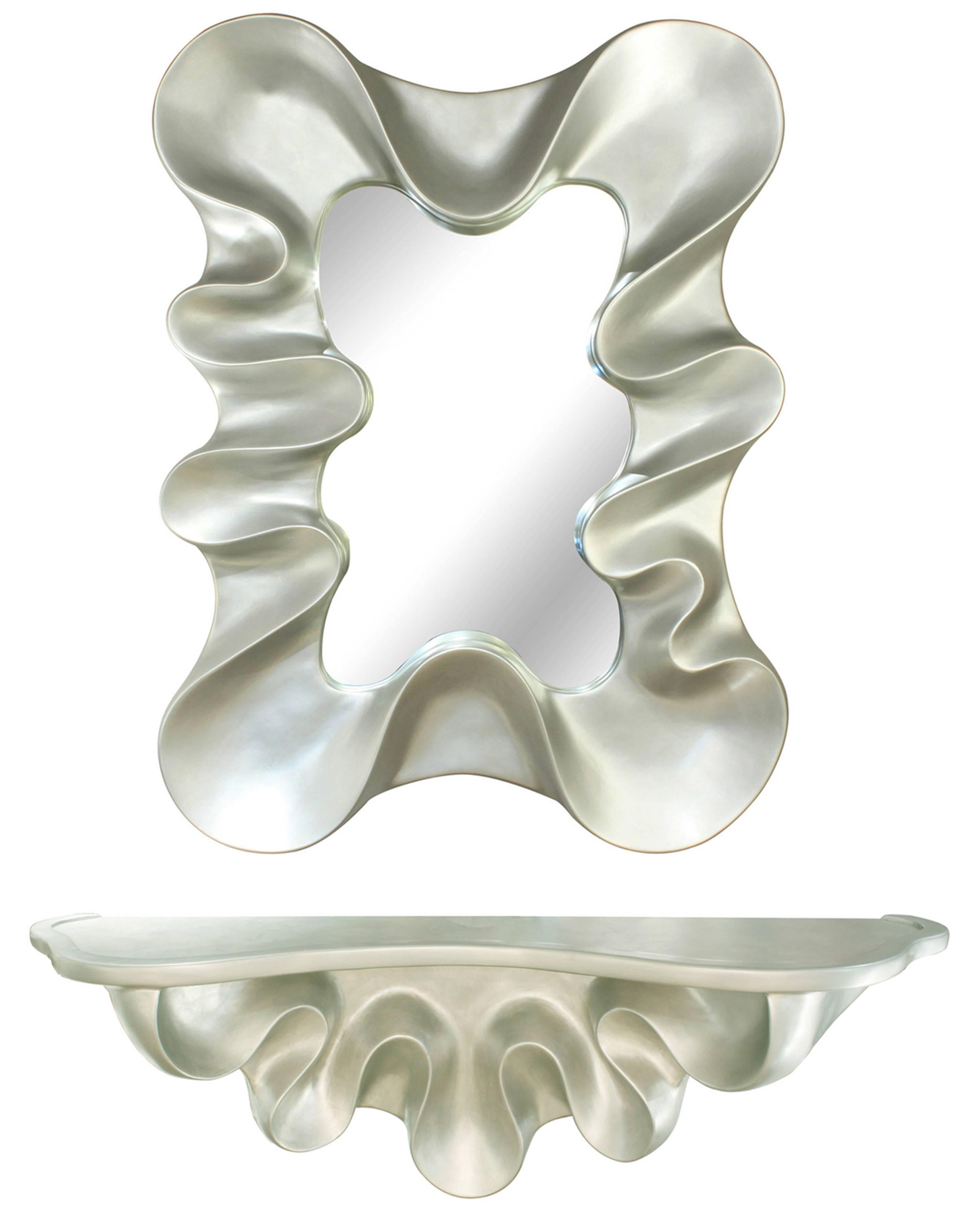 Curvaceous mirror in plaster with silver leaf by Lawrence De Martino, American 2002 (signed and dated on verso). Matching console sold separately.