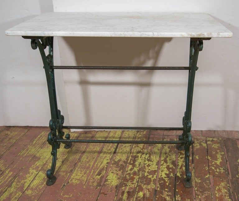 Venetian marble top table with iron base.