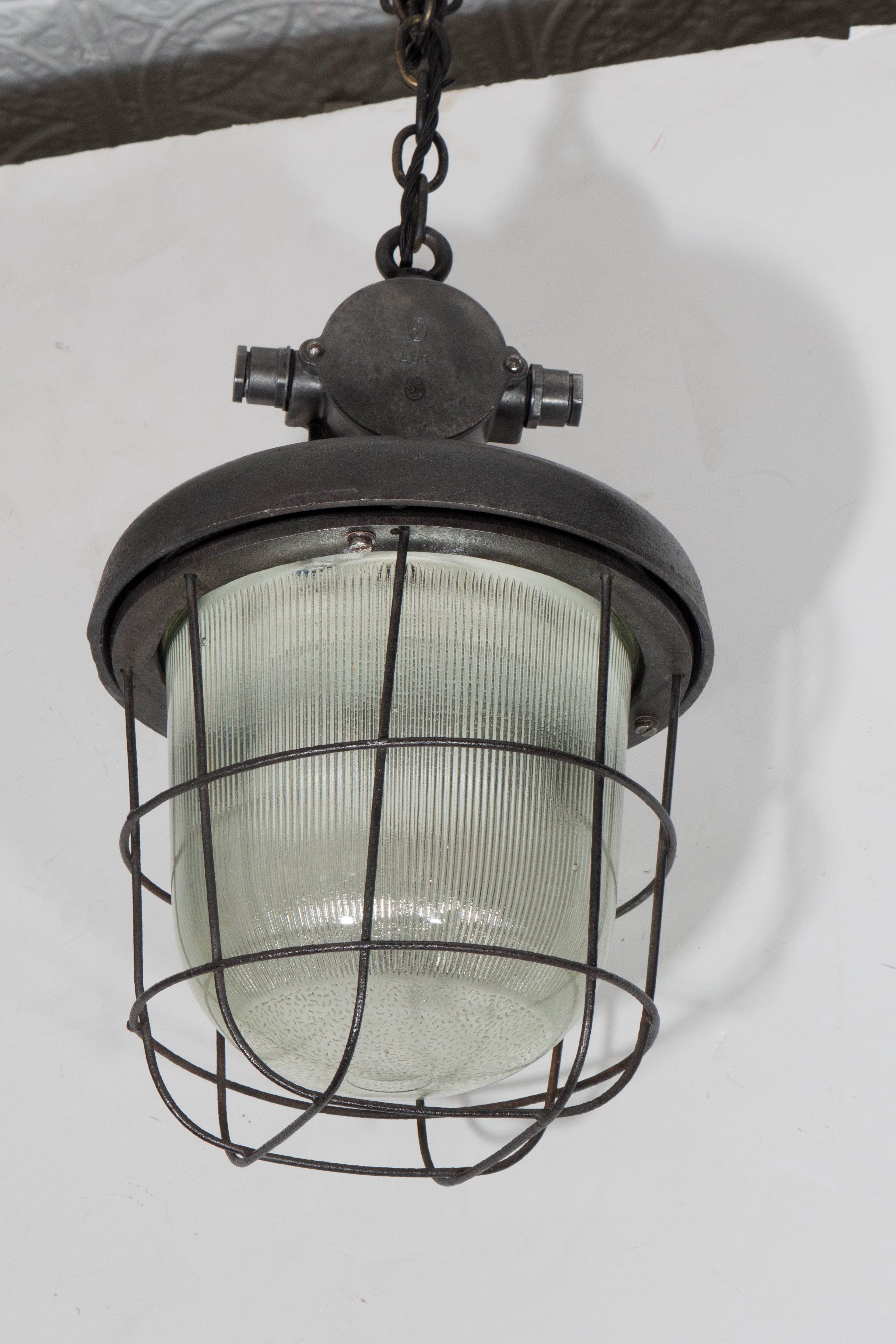 Industrial Cage Light with Ribbed Glass For Sale