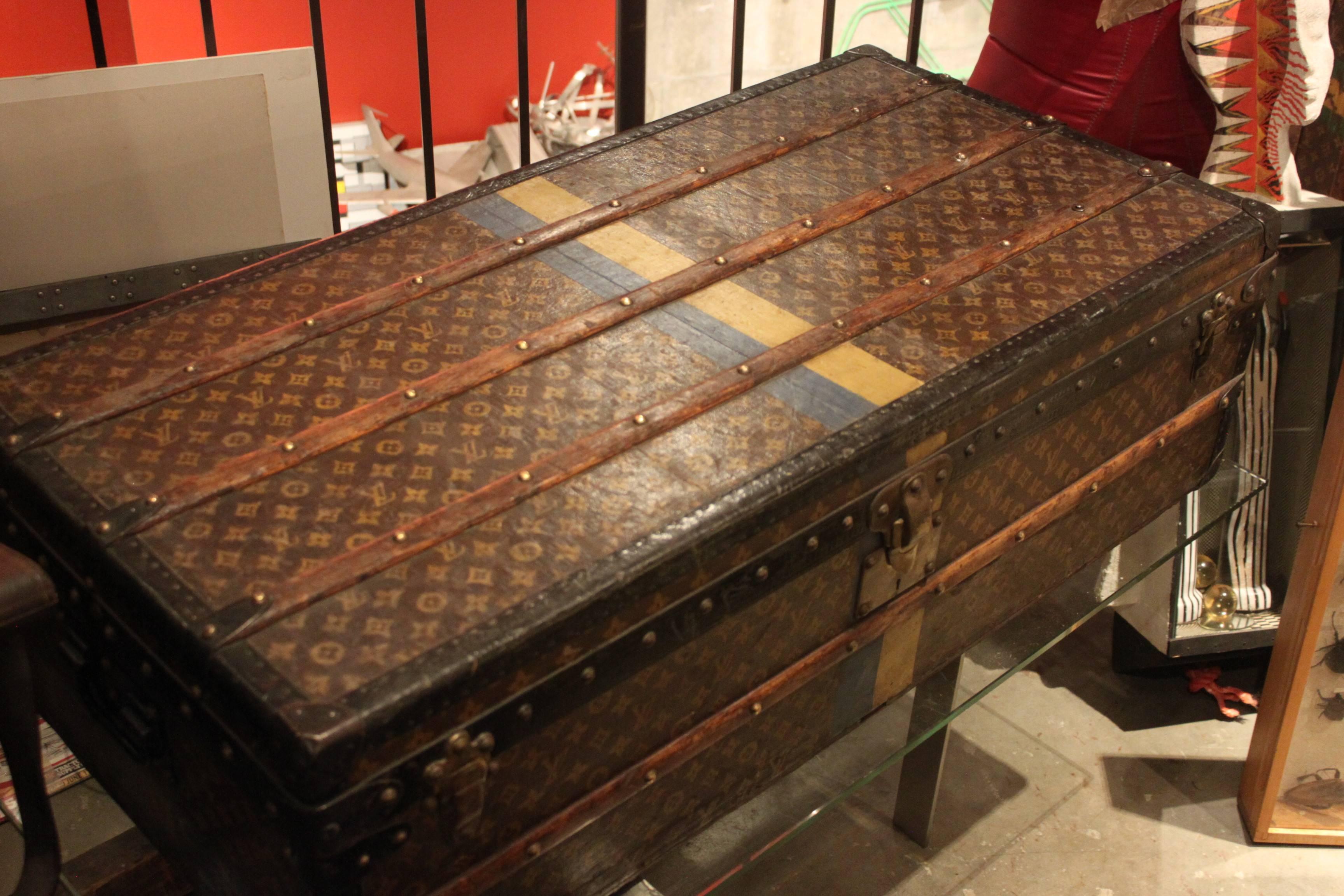 Fabulous 1930s Louis Vuitton steamer trunk with great original monogramming and striping. Perfect coffee table size.