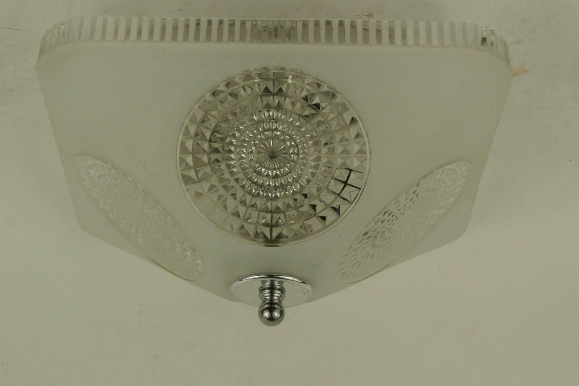 #1-2999ab, a deco style square shaped frosted /clear glass flush mount. Two internal light cluster. Newly rewired.
 Two available. Priced individually.