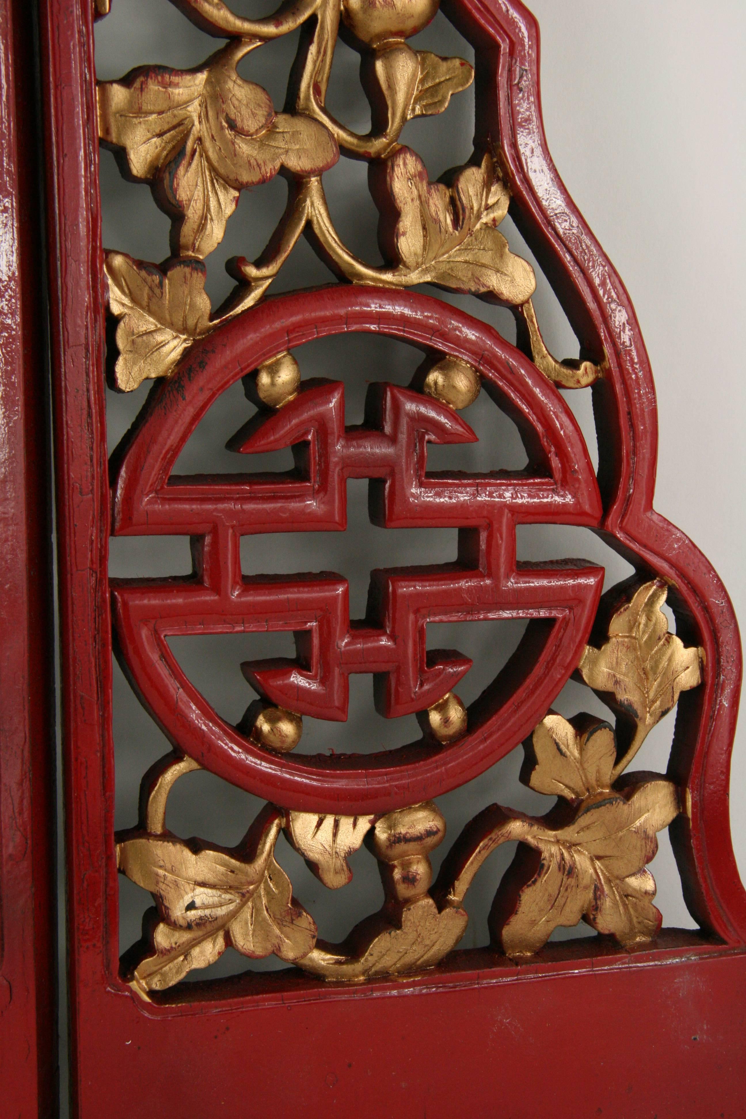 9-309 pair of antique Chinese intricately hand-carved wood panels with red and gilt finish.
Each panel measures: 25.5