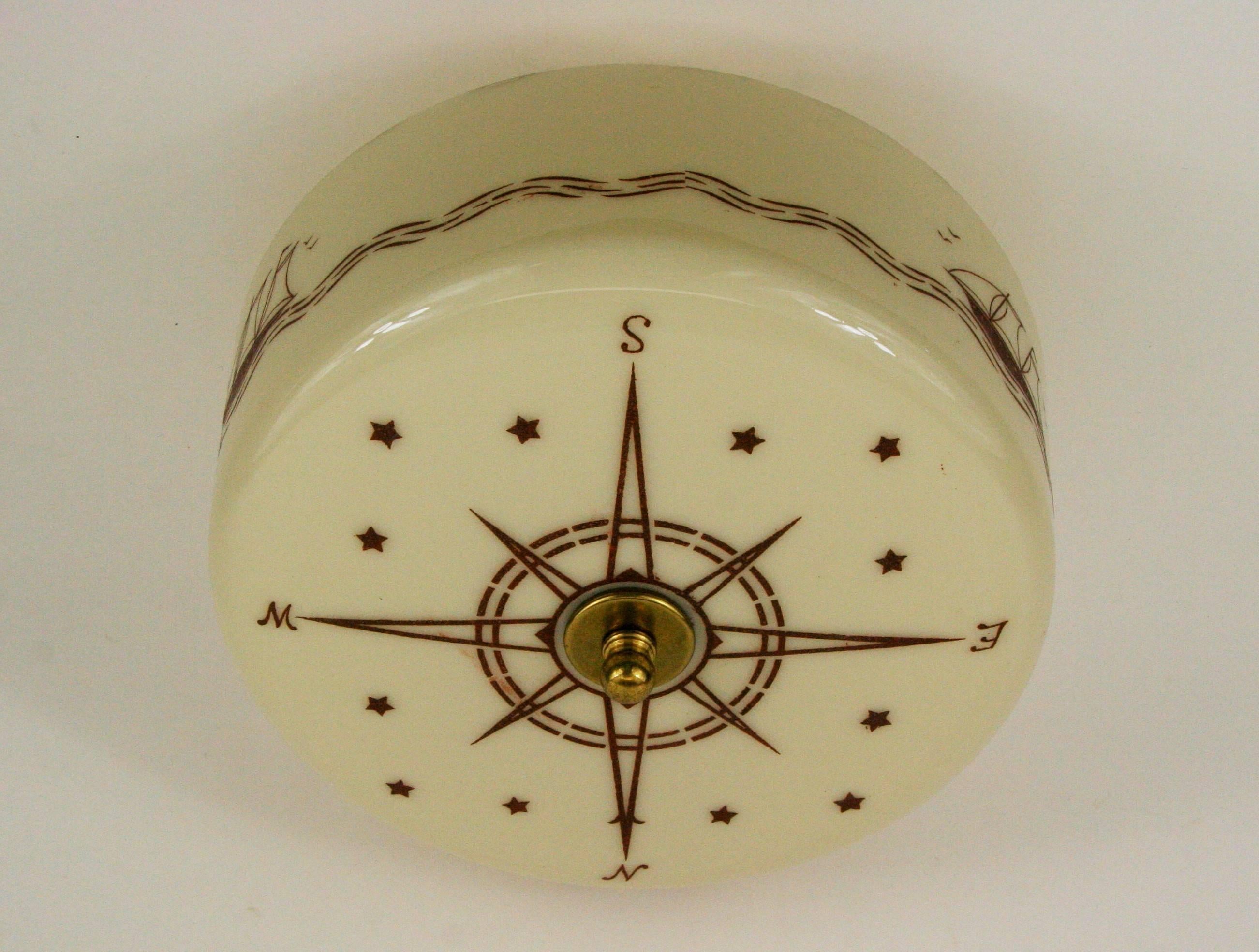 1-5000a, a ships wheel and compass nautical glass semi flush mount. Two internal 60 watt Edison base bulbs. Newly rewired.
