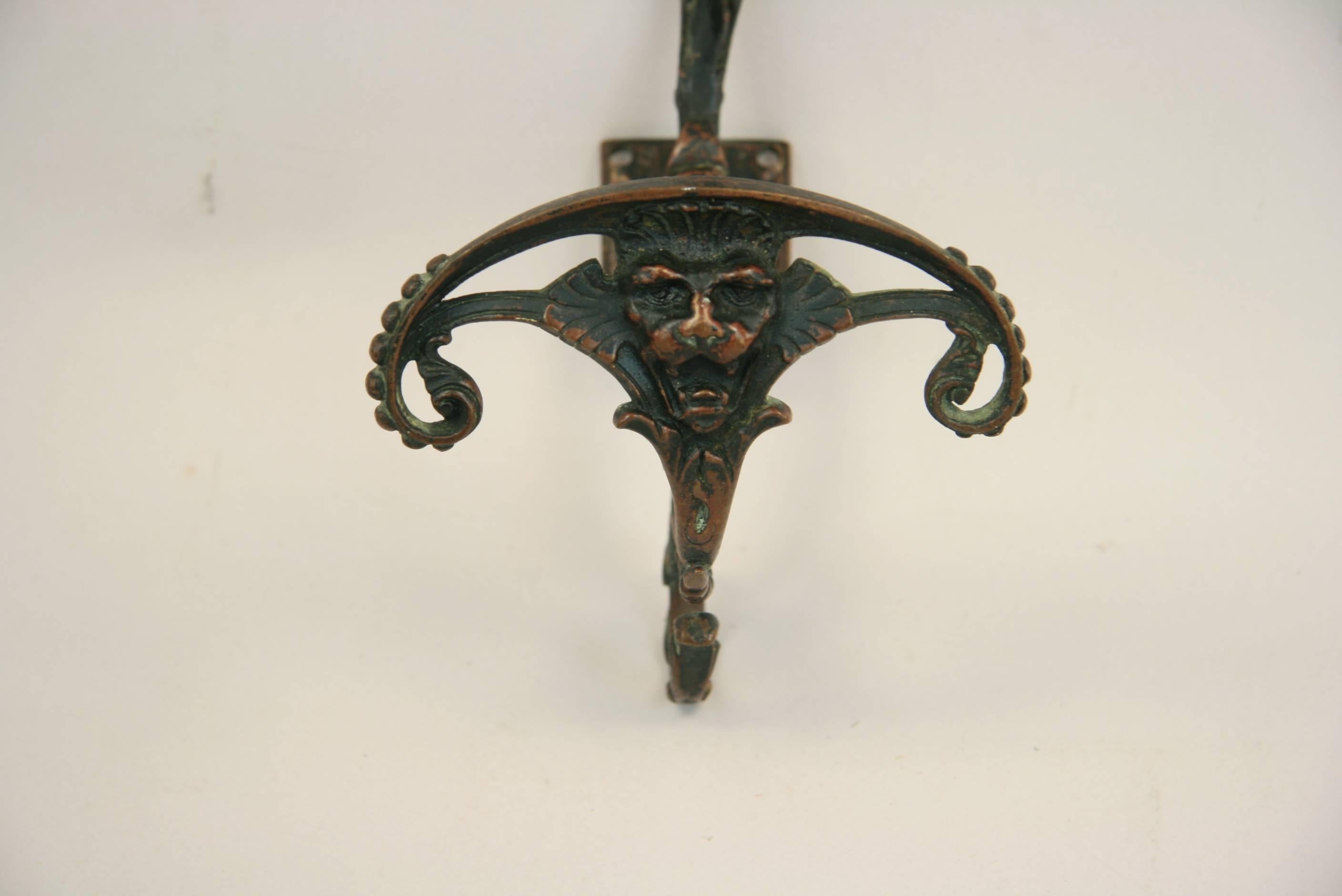 9-055, 19th century Italian bronze figural coat holder.
Has four holes on backplate for mounting.